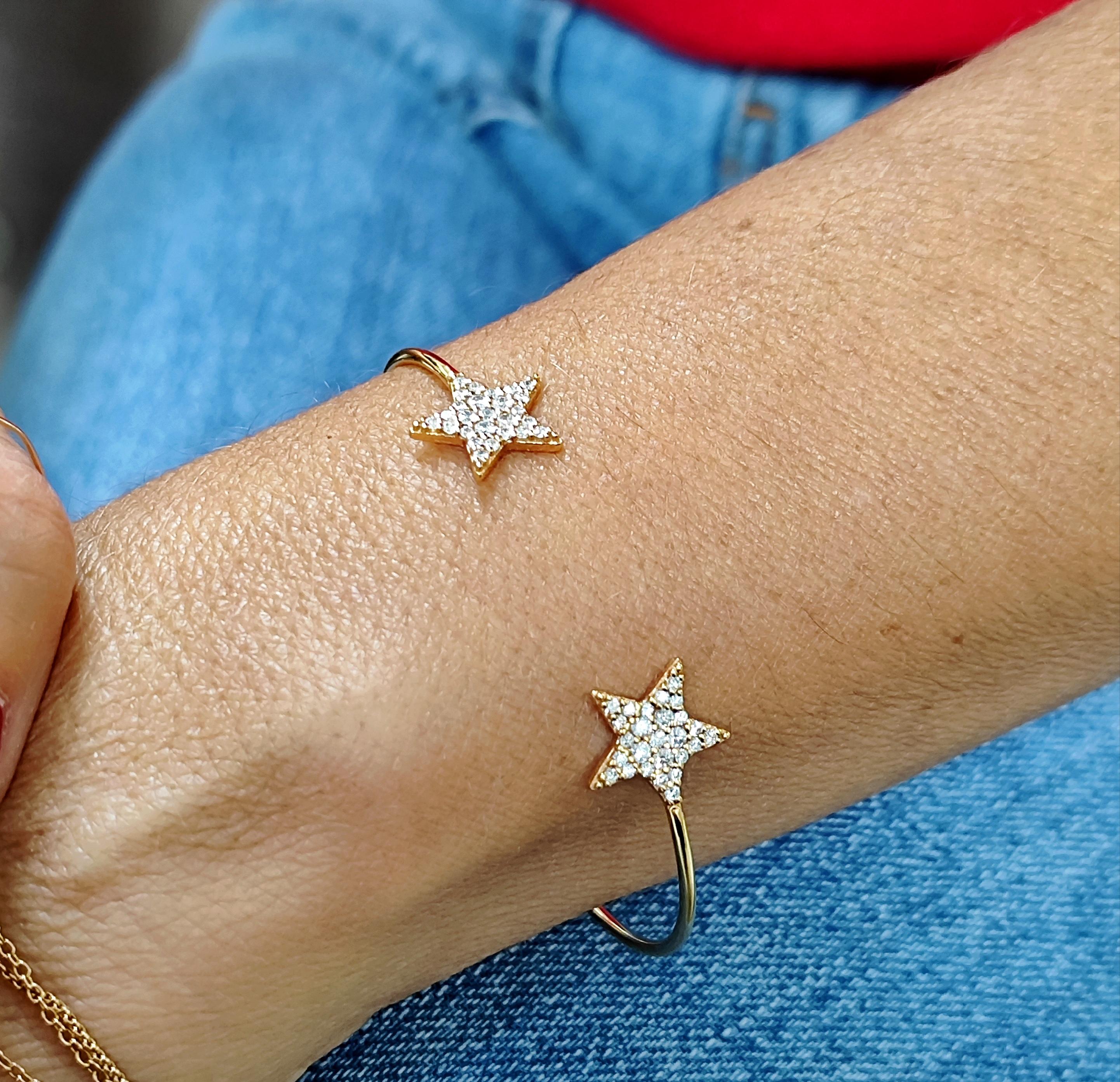 This 18KT rose gold & diamonds star cuff is easy to wear and does not need to be removed when sleeping as it is light and confortable. 
The 2 diamonds pavé stars bring preciousness to the cuff that is made of 6grams of 18kt gold 
Diamonds are known