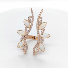 18kt Rose gold Fashion ring with marquise cut Opals and 0, 85 ct diamonds