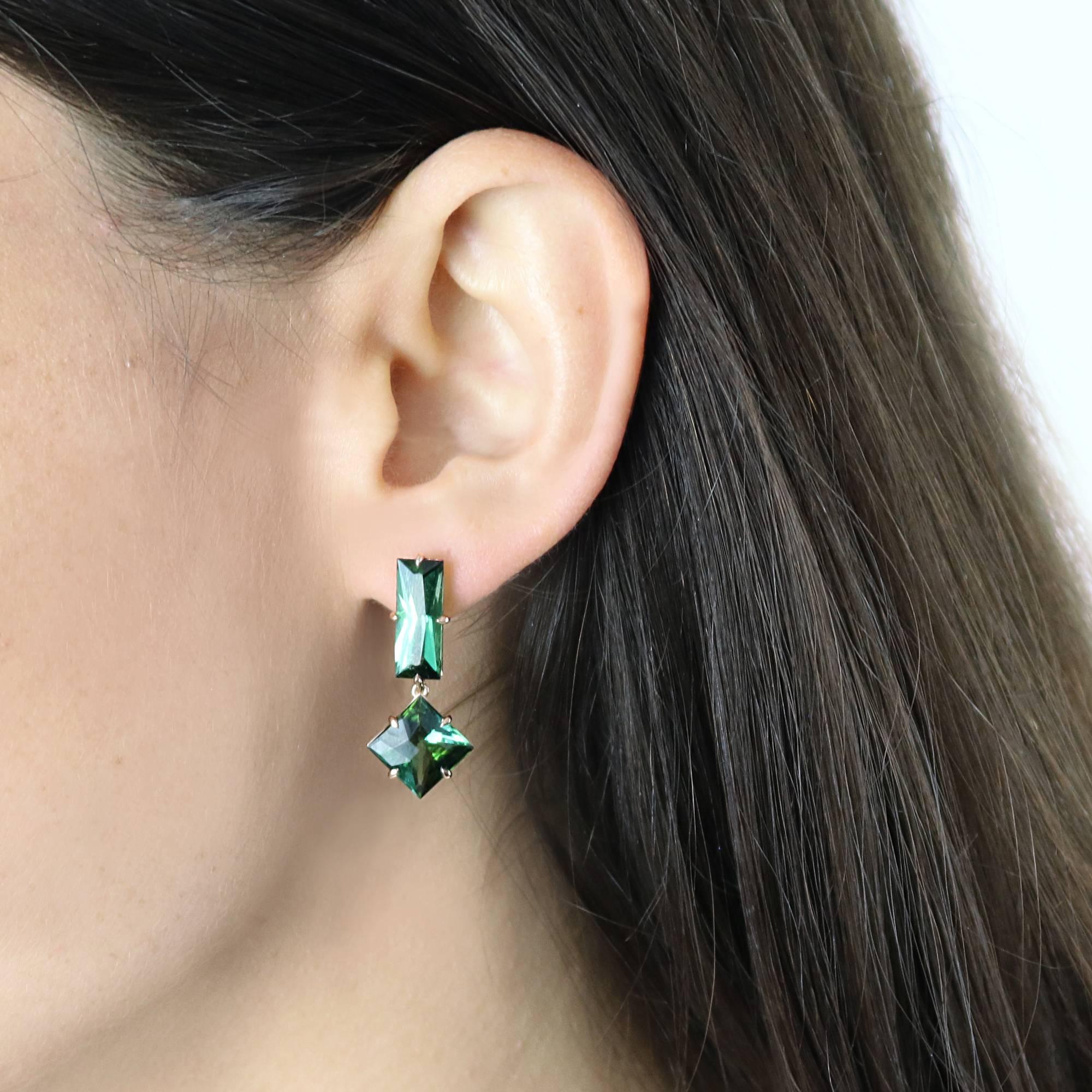 One of a kind emerald cut green tourmaline earrings, 5.93 carats with square shaped green tourmaline pendants, 5.82 carats set in 18kt rose gold.

Clean lines, absence of metal and great proportions make this pair of green tourmaline earring a