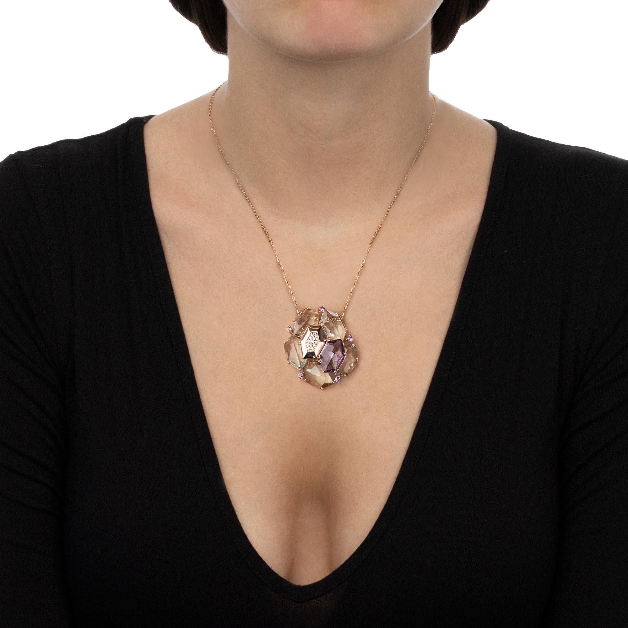 This necklace is an handmade contemporary jewellery piece with a modern design that is bold and sophisticated at the same time. The distinctive asymmetrical setting of the pendant lets the gemstones sparkle bright, drawing the light around your