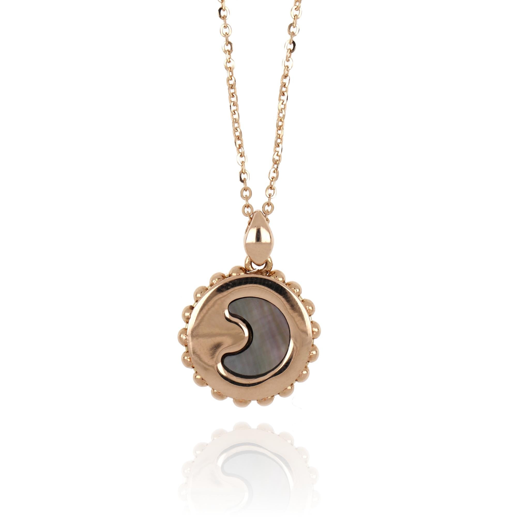 Romantic and effortlessly chic, this necklace is the perfect complement to an evening attire and will surprise you with its playful design. On one side the pendant features a central crescent moon shape in mother-of-pearl, framed by pavé set