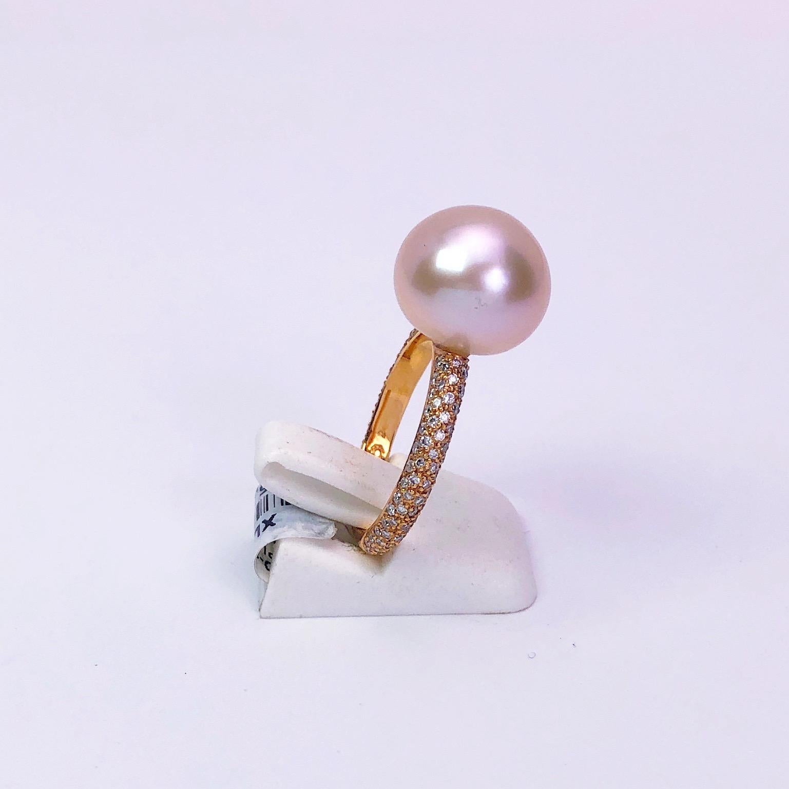 Cellini Jewelers NYC 18 karat rose gold ring set with a single pink South Sea Pearl. The pearl sits on a micro pave diamond shank.
Total Diamond weight 0.61 carats
Pearl 12.8 mm
Stamped 750
Size 6.75 sizing may be available