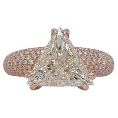 18kt Rose Gold Ring with 3.07ct Trillion Cut Diamond& 1ct Brilliant Cut Diamonds