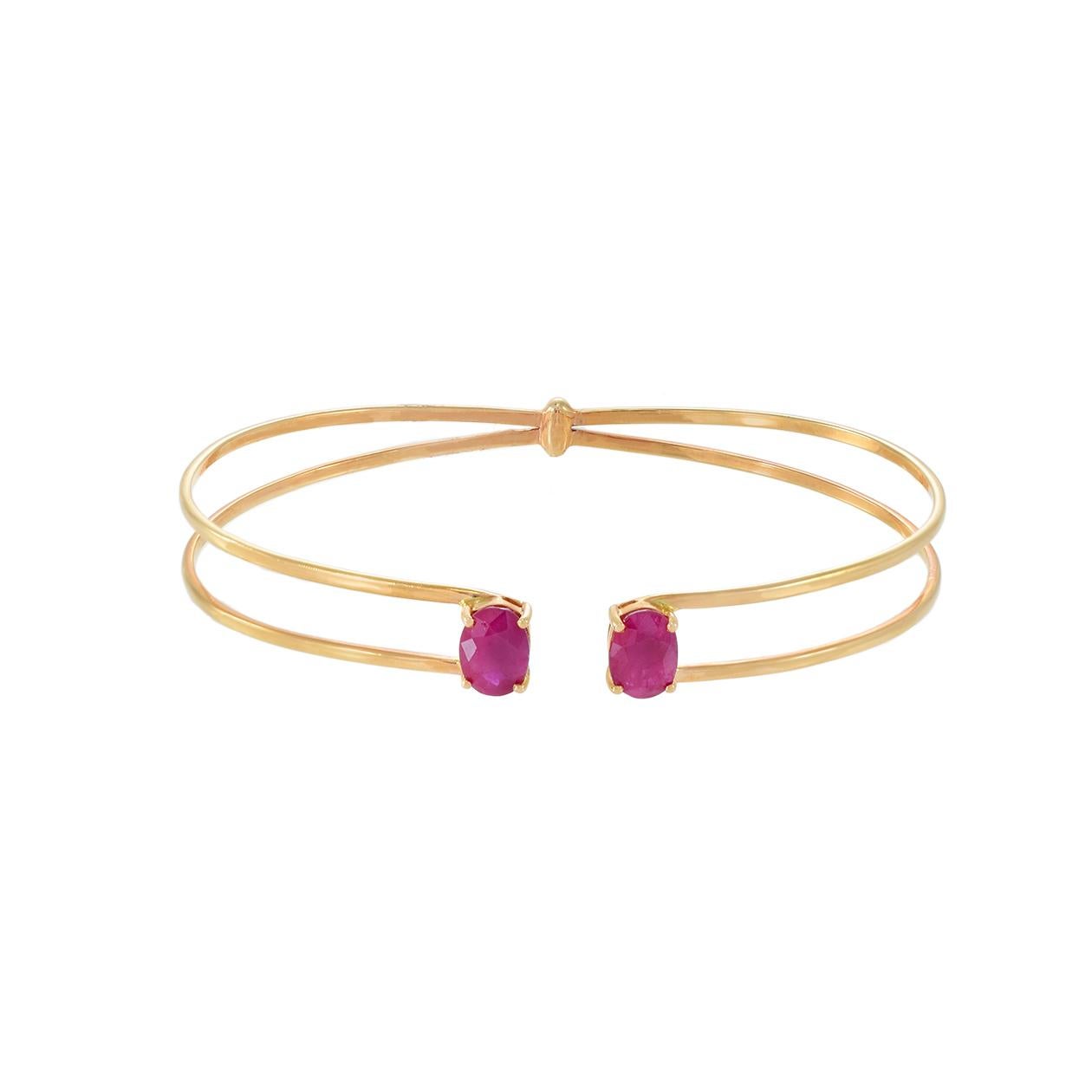 Presenting our exquisite 18KT Rose Gold Double Flex Cuff Bangle Bracelet, a true embodiment of elegance and sophistication. This stunning bracelet features two magnificent oval-cut genuine rubies, with a total weight of 2.65 carats. The warm, rosy