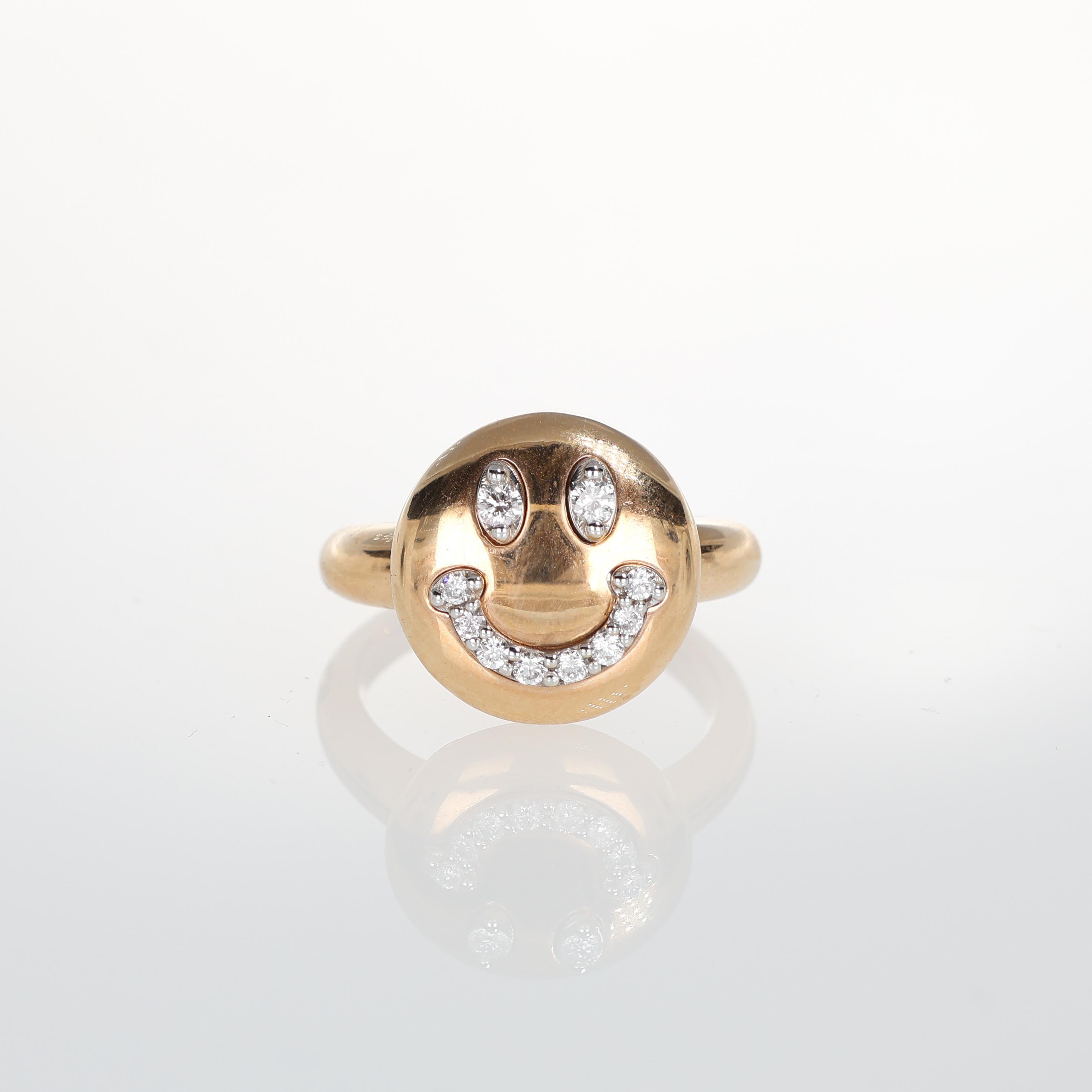 A playful yet sophisticated 18kt rose gold ring featuring a smiley face adorned with brilliant-cut diamond pavé. A unique statement piece that blends whimsy with luxury, perfect for those who appreciate fine jewelry with a touch of fun.

Key