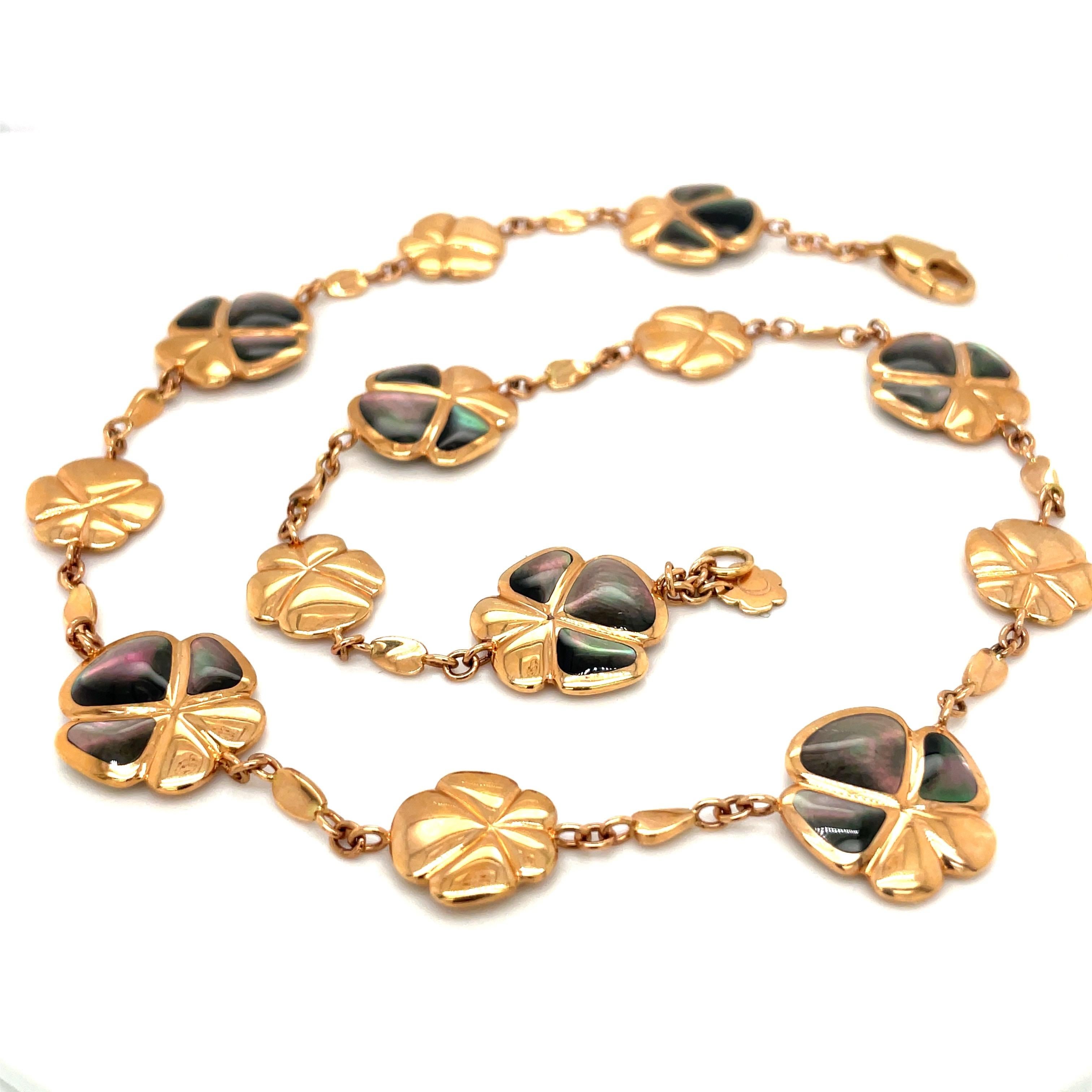 Created by famed Italian Jewelers, De AMBROSI, exclusively for Cellini Jewelers this flower necklace is inlaid with black mother-of-pearl alternating with small gold flowers. As a show of the excellent craftsmanship the flowers are completely