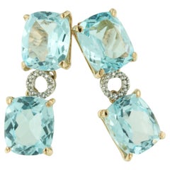 Superbes boucles d'oreilles de mode modernes en or rose 18 carats avec topaze bleue et diamants blancs