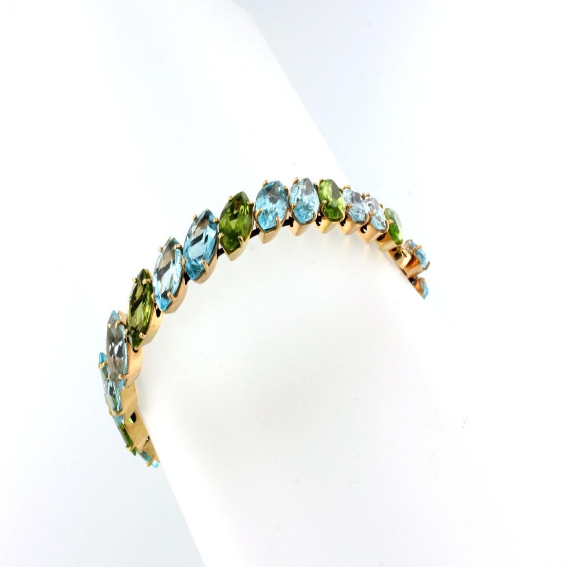 Modern 18kt Rose Gold with Peridot and Blue Topaz Bracelet For Sale