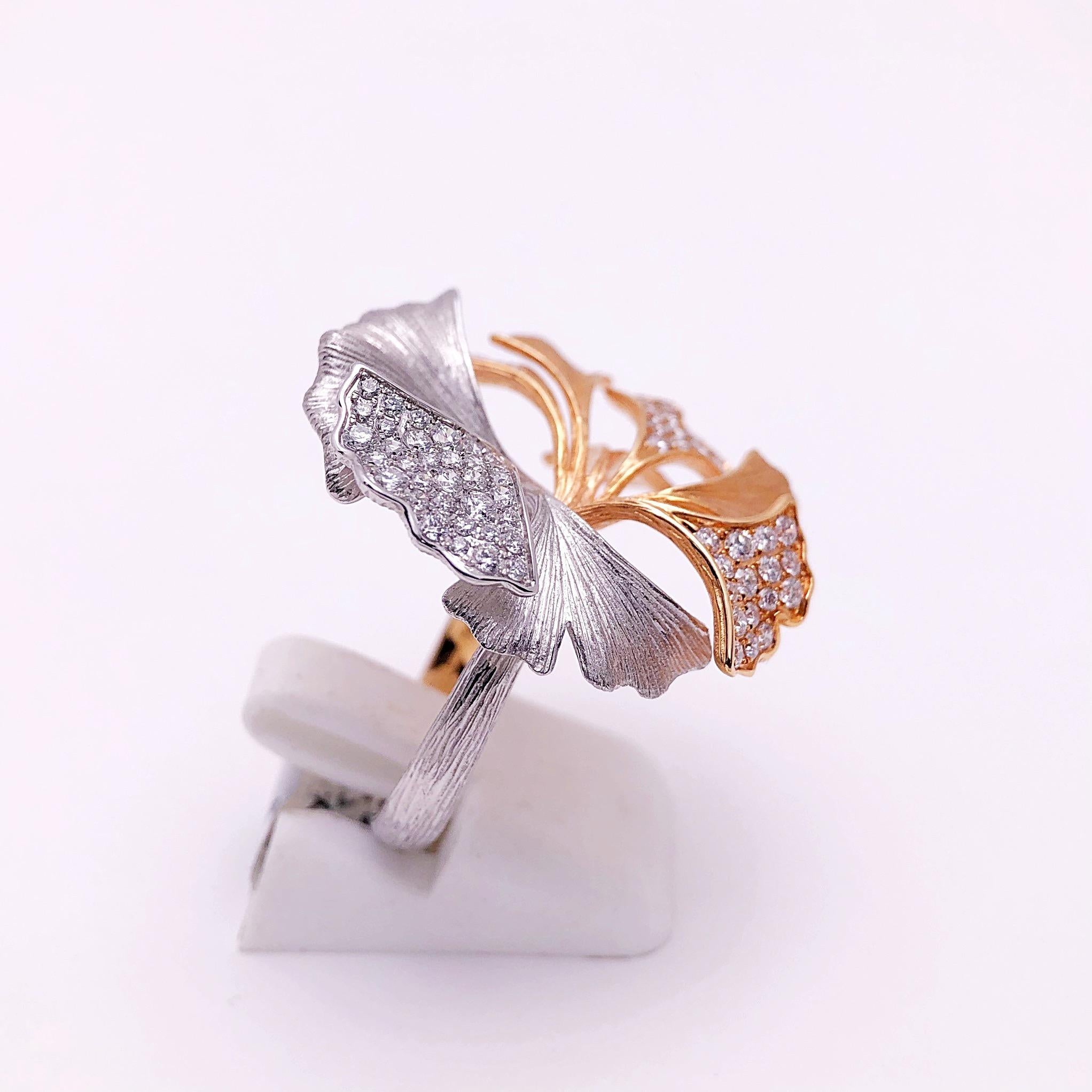 This beautiful Ginko Leaf ring is designed with 9 petals in a soft matte finish.  Four of the petals are set with 75  round brilliant diamonds. The leaves are detailed with veining. The combination of the rose and white gold with diamonds makes this