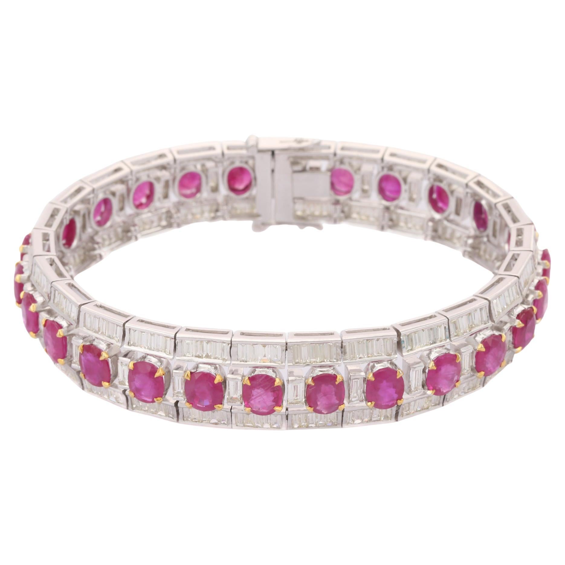 This Diamond Ruby Tennis Bracelet in 18K gold showcases 26 endlessly sparkling natural ruby, weighing 21 carat and diamonds weighing 8.5 carat. It measures 7 inches long in length. 
Ruby gemstone improves mental strength.
Designed with perfect oval