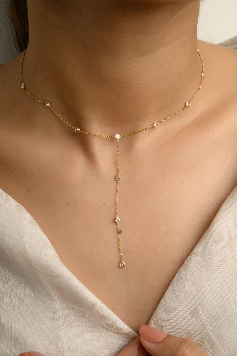1 Carat Diamond Lariat Necklace in 18K Gold studded with round cut diamond. This stunning piece of jewelry instantly elevates a casual look or dressy outfit. 
April birthstone diamond brings love, fame, success and prosperity.
Designed with bezel