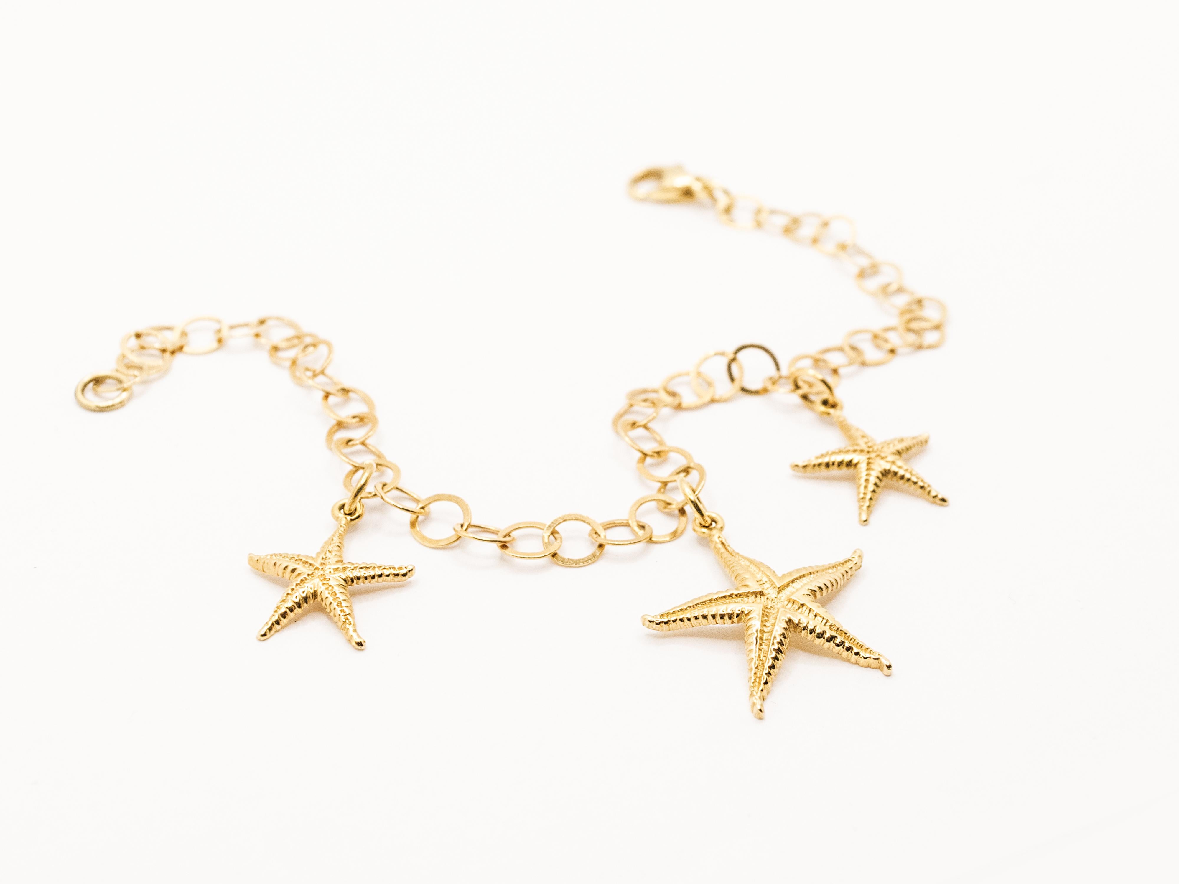 A unique bracelet completely handmade embellished with three starfish charms.
The round link is hand made too and it gives the possibility to resize the bracelet ( length is 21 cm/ 8,26 in ).
The charms are carved in a very naturalist way and they