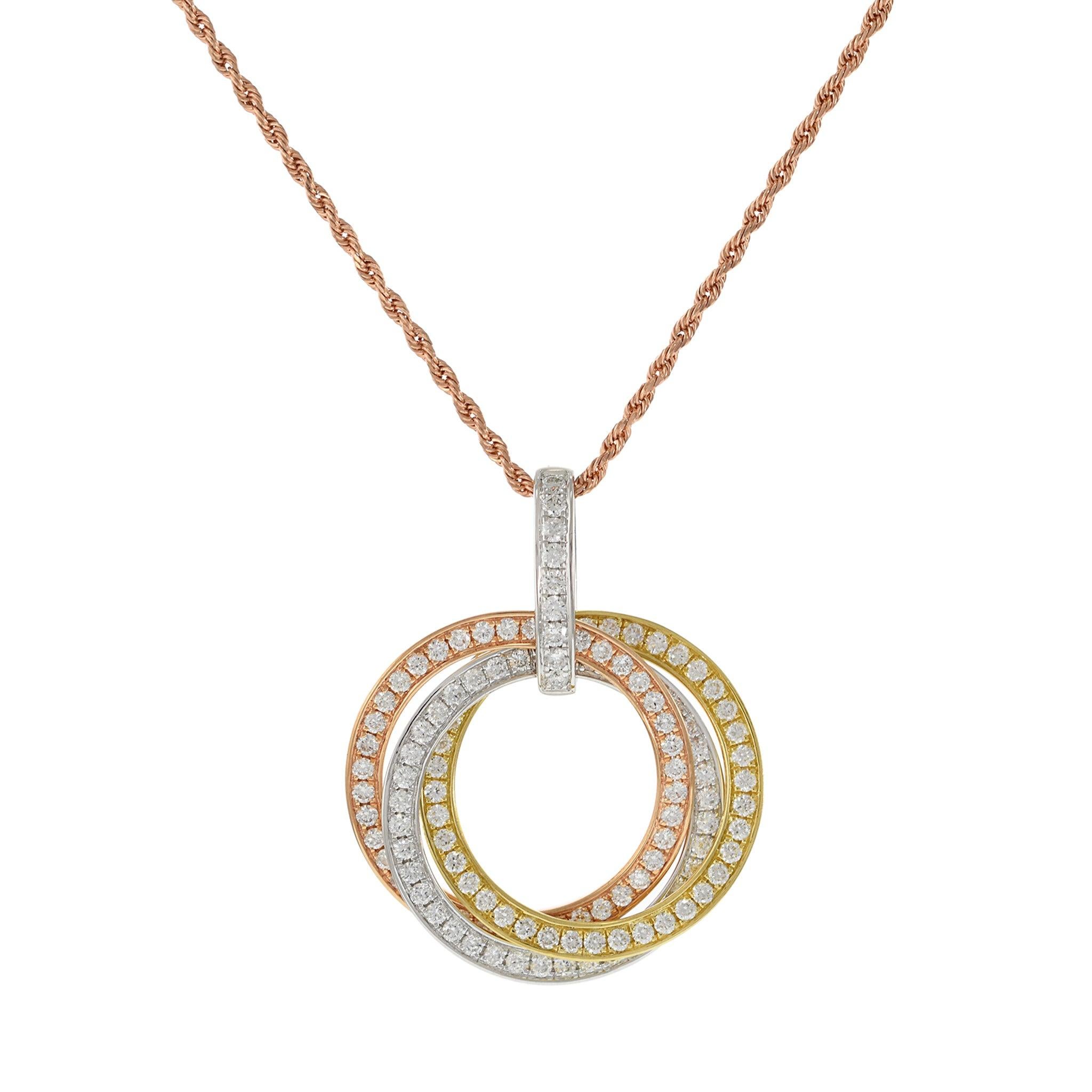 This exquisite pendant features an interlocking triple circle design, crafted in 18KT tri-color gold. It is adorned with 1.10 carats of round cut diamonds, with G color and VS clarity, adding a brilliant sparkle to the unique design. Perfect for