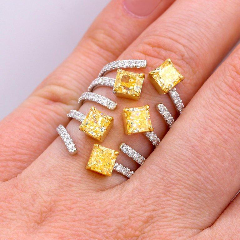 18kt two tone multi shaped fancy yellow diamond ring with 3.54 carats of five yellow diamonds and 0.90 carats micro pave diamonds.
