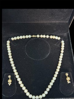 18KT UNOAEERE earrings WITH 14kt gold clasp Quality Cultured pearl necklace.