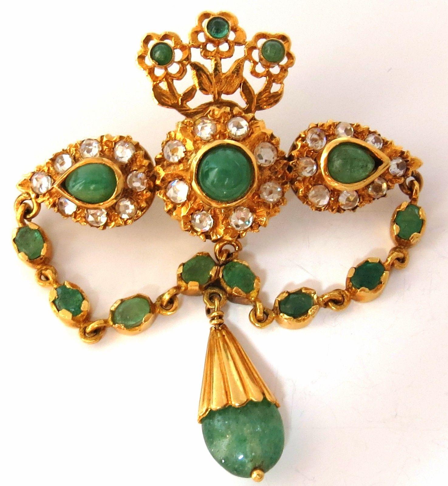 Majestic Class.

4.00cts of emeralds & white sapphires brooch pin.

Cabochons & Old miner cuts.

18kt yellow gold 

22 grams.

Overall: 2.42 X 2.09 inch

Excellent made 