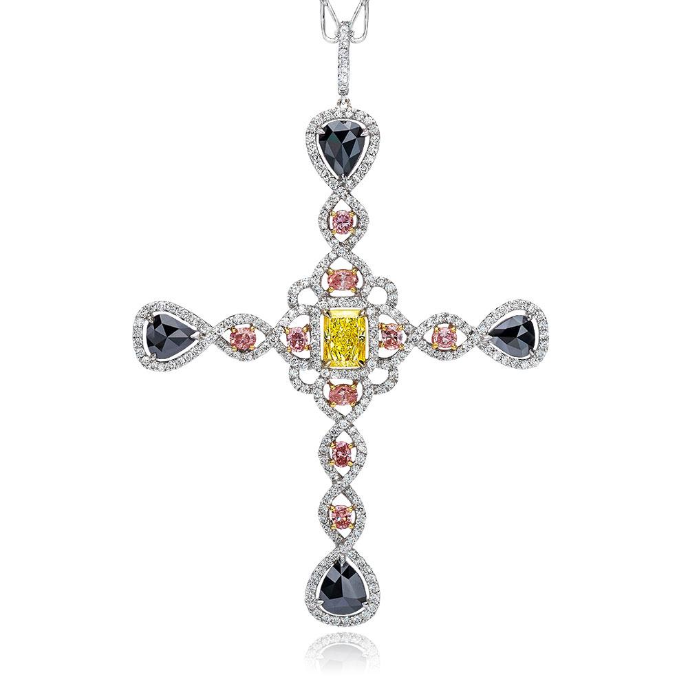 This uniquely designed cross centers a fancy yellow radiant cut diamond. Natural pink diamonds in fancy shapes and pear shaped black diamonds are set through out the micro pave white diamond setting. The elegant cross hangs on a handmade 18 karat