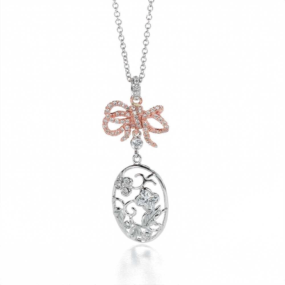 18KT white and rose gold bouquet bow diamond flower pendant. .1 LILY CUT ® flower shape diamond H color VS SI clarity 0.23 cts . additional 0..33 ct round diamond accent . overall length of drop 1 1/2 inch. 3.7 cm . overall size 17 inch necklace