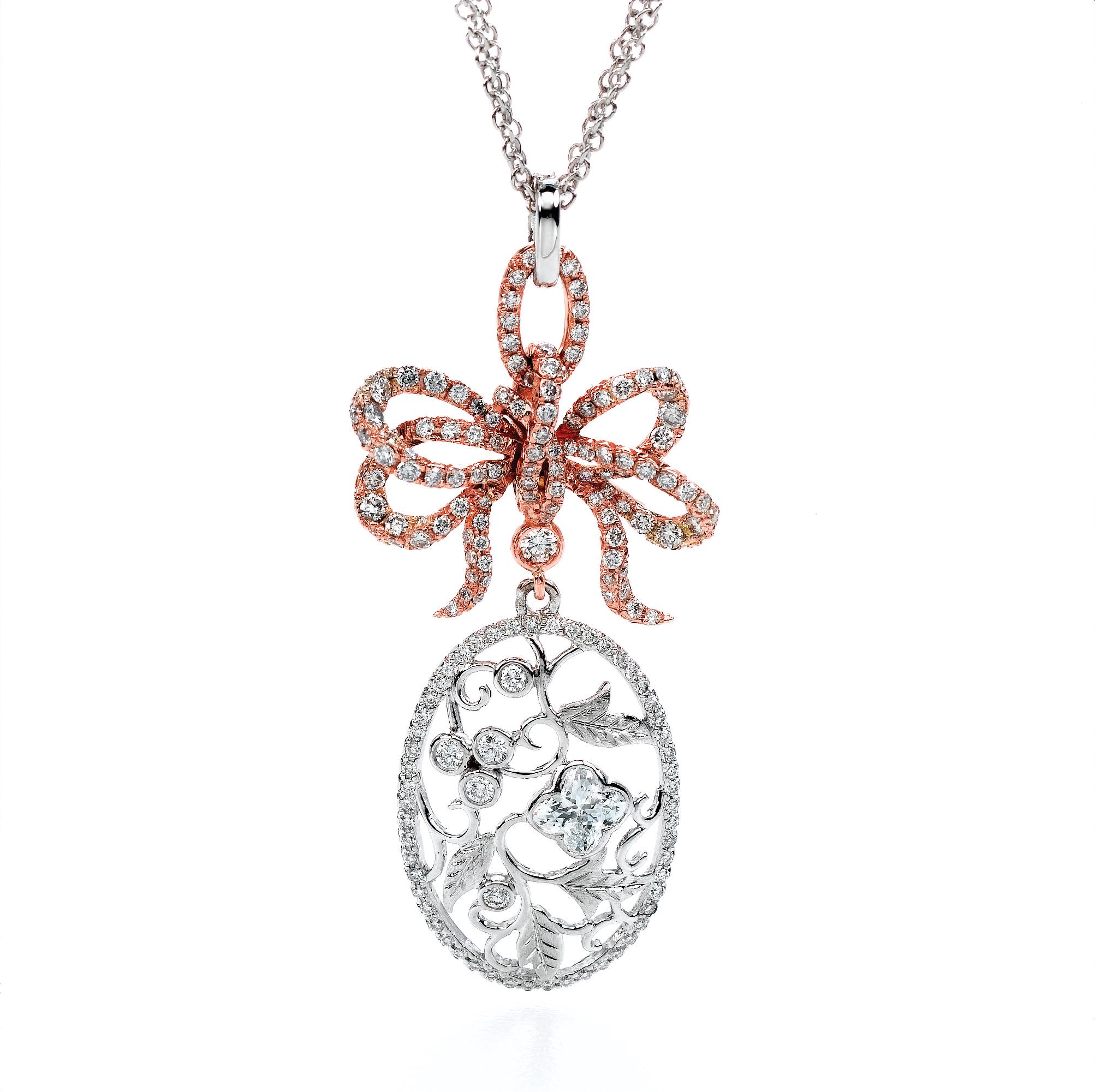 18KT white and rose gold bouquet  diamond flower pendant.  .1 LILY CUT ® flower shape diamond H color VS SI clarity  0.50cts . additional 1.22 ct round diamond accent . overall length of drop  2 inch. 5 cm .  overall size 17 inch necklace with a 2