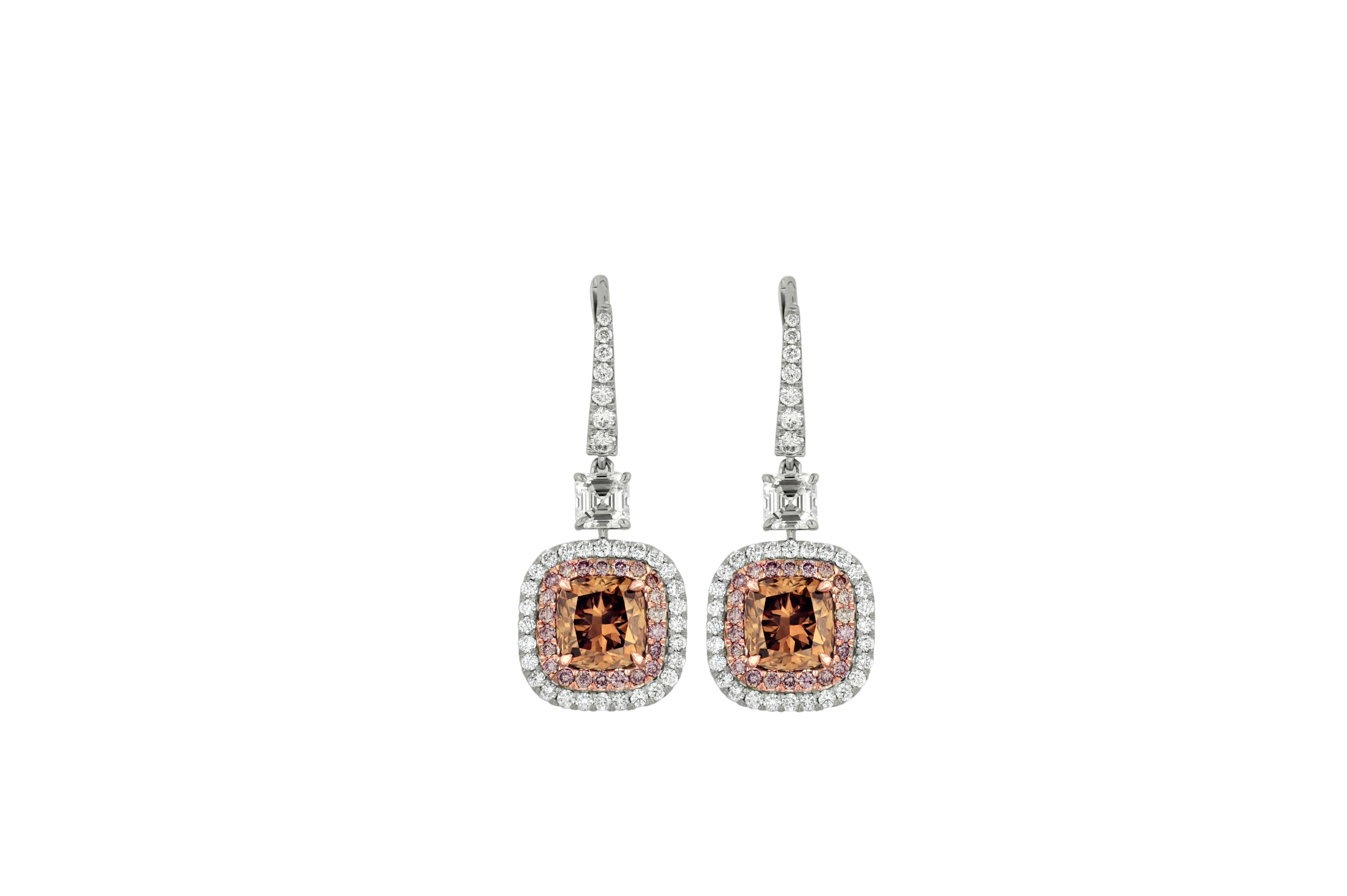 18kt white and rose gold gia certified fancy brownish diamond earrings, features 4.09 fyb (2.01 fb si2 radc949 & 2.08 fb vs1 radc950) set in halo setting with 2.35ct of white and pink diamonds. 
