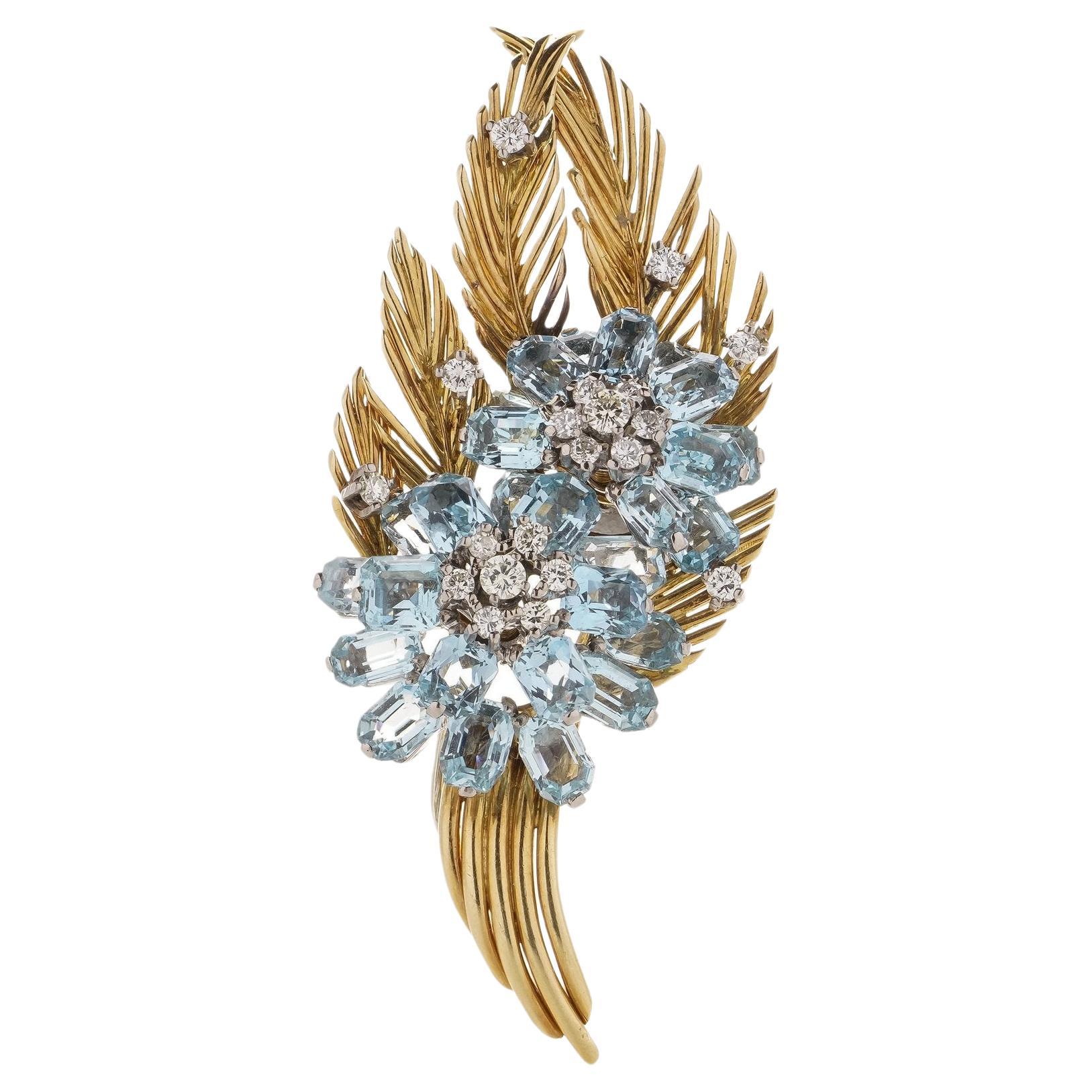 Vintage 18kt. white and yellow gold flower spray brooch, set with 10.00 carat Aquamarines and 0.75-carat Diamonds. 

Made in Circa 1970's 
X-Ray tested positive for 18kt gold. 


The dimensions -
Length x width x depth: 7.2 x 2.8 x 2 cm 
Weight: 26