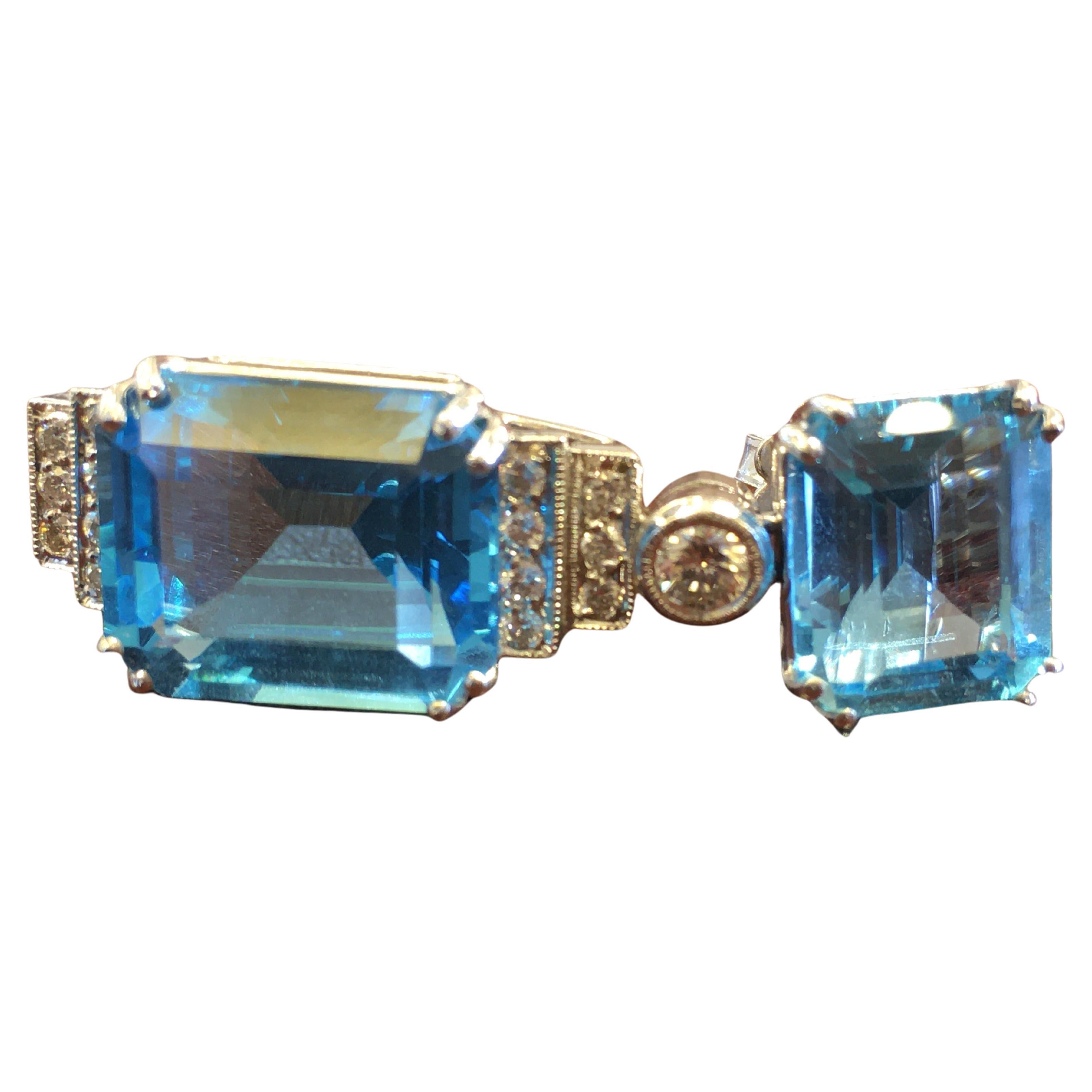 18kt White Gold, 0.80Ct Diamonds, 22.50Ct Blue Topaz Earring