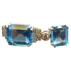 Boucles d'oreilles en or blanc 18 carats, diamants 0,80 carat, topaze bleue 22,50 carats