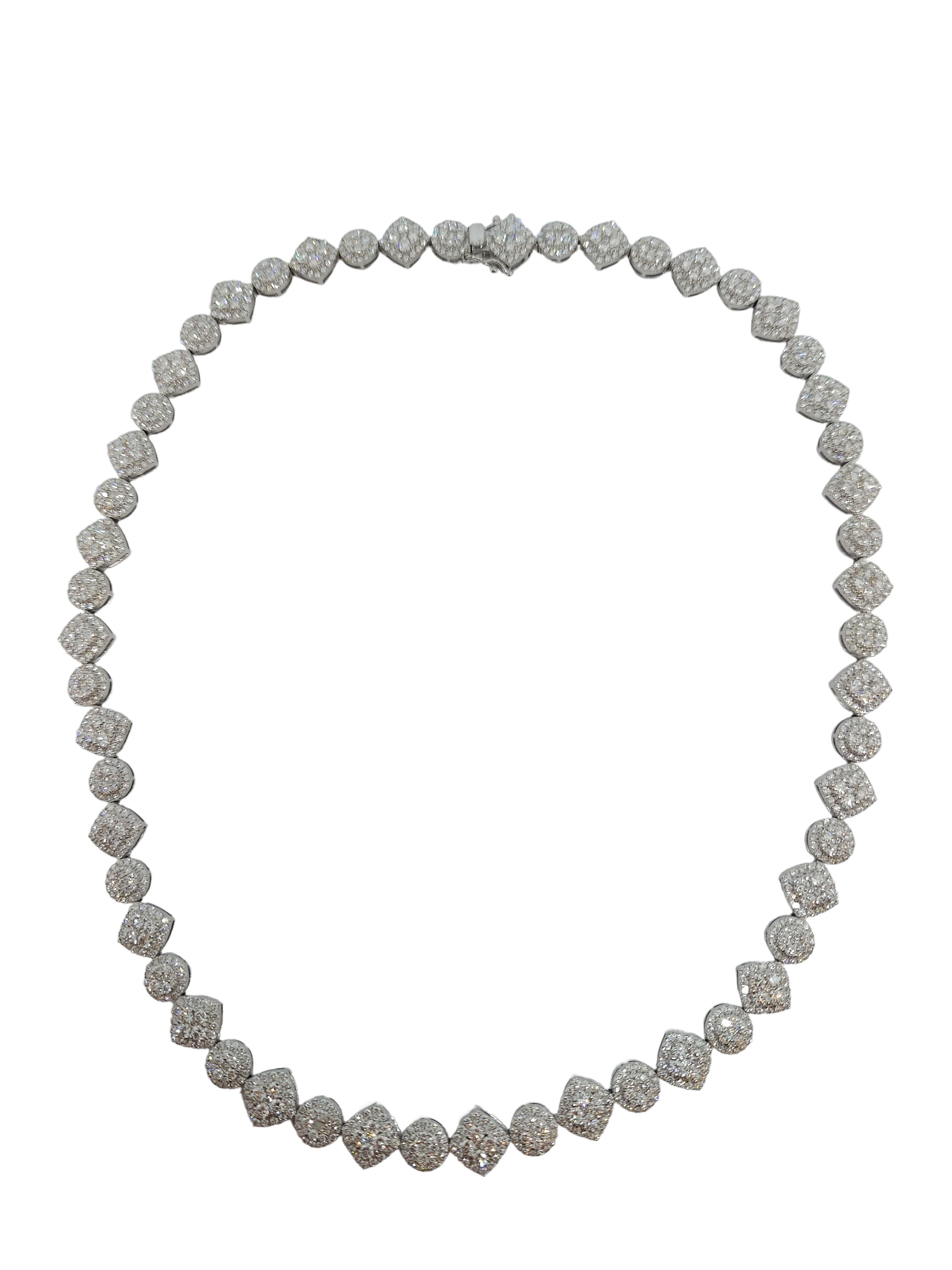 18kt White Gold Diamond Tennis Necklace, Can be purchased with the same beautiful Tennis Bracelet

Diamonds: 1242 Diamonds, Together 13.48ct, G/H VS

Material: 18kt white gold

Total weight: 44.9 gram / 1.585 oz / 28.9 dwt

Measurements: 45 cm long