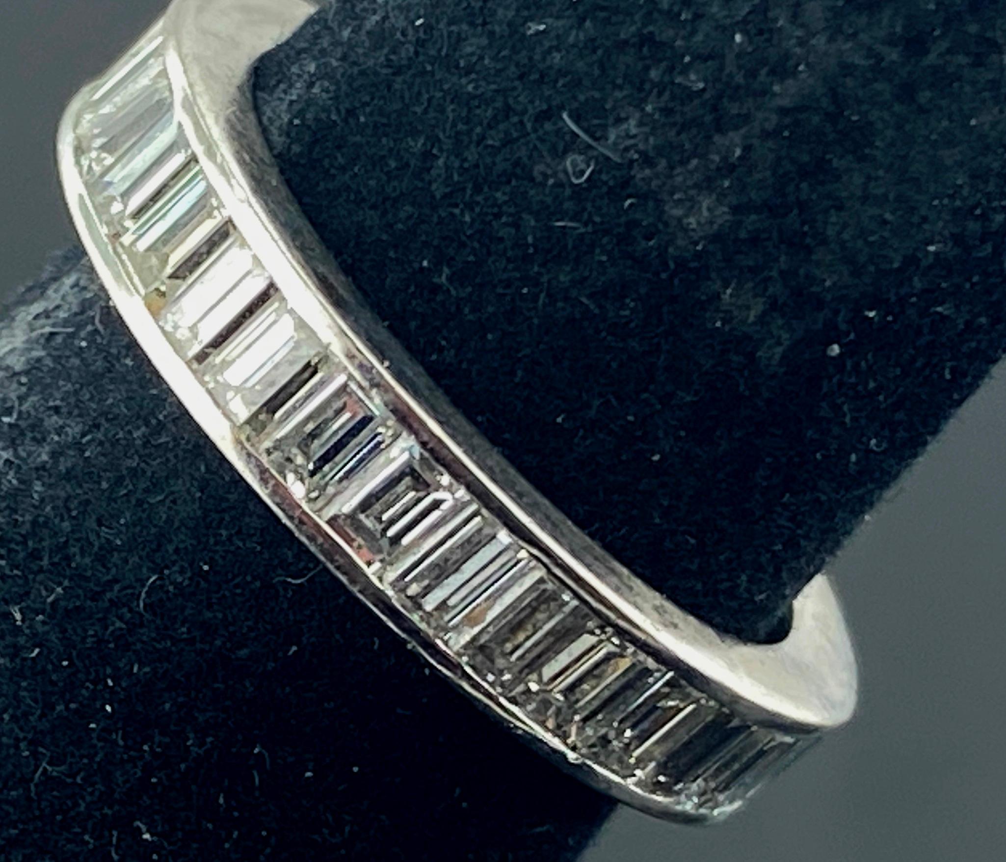 Set in an 18 karat white gold eternity band are 58 Baguette Cut diamonds with a total weight of 1.50 carats.  Color is G, Clarity is VS.  Ring Size is 6.5.