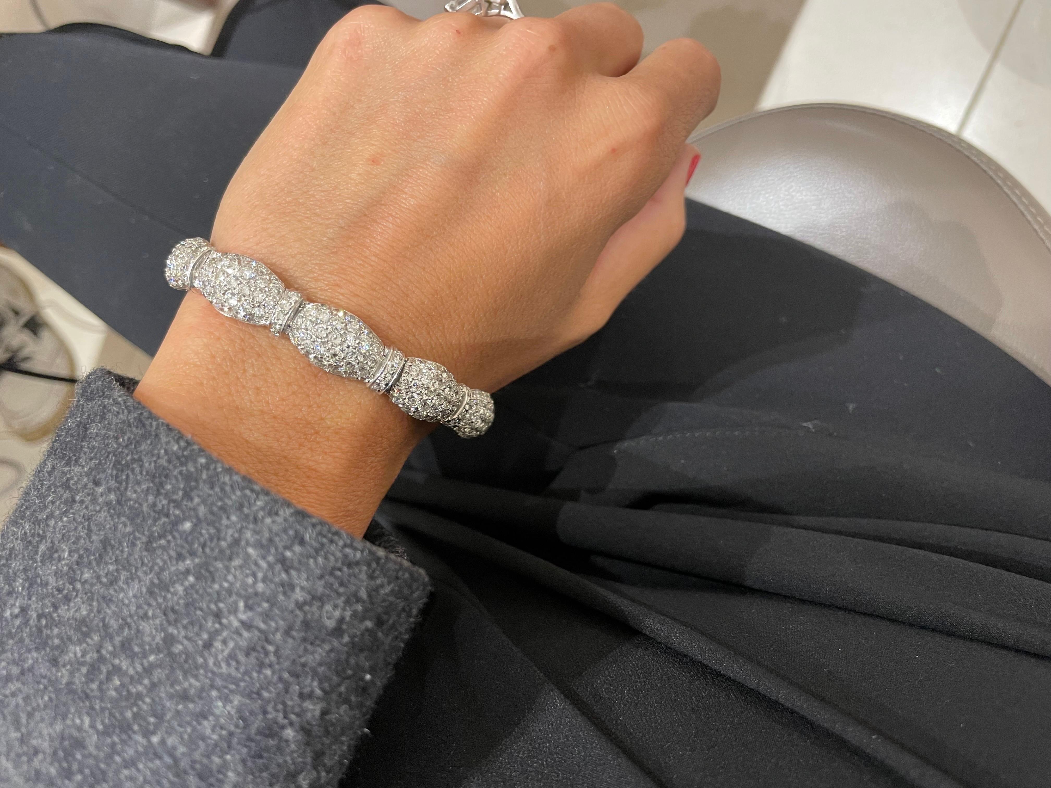 Designed with 10 oval diamond sections, joined with diamond set rondelles, this elegant bracelet remains a classic. The 18 karat white gold bracelet is set with 15.60 carats of round brilliant diamonds and is 7.5