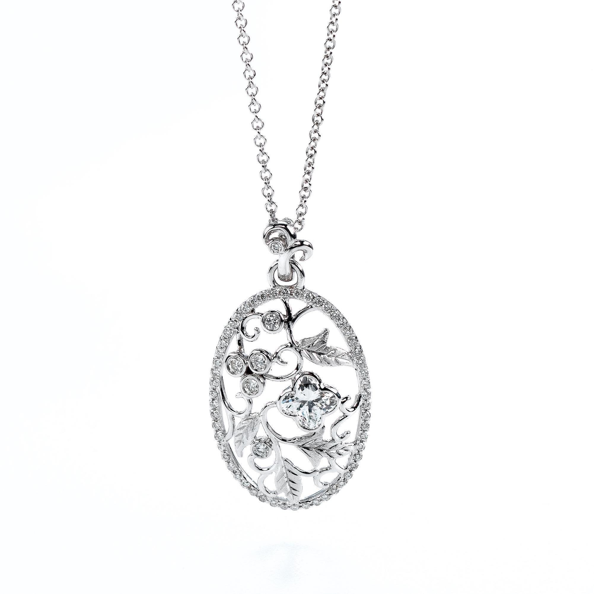 18KT white gold bouquet  diamond flower pendant.  .1 LILY CUT ® flower shape diamond H color VS SI clarity  0.23cts . additional 0.07 ct round diamond accent . overall length of drop 1 inch. 2.5 cm .  overall size 17 inch necklace with a 1 inch