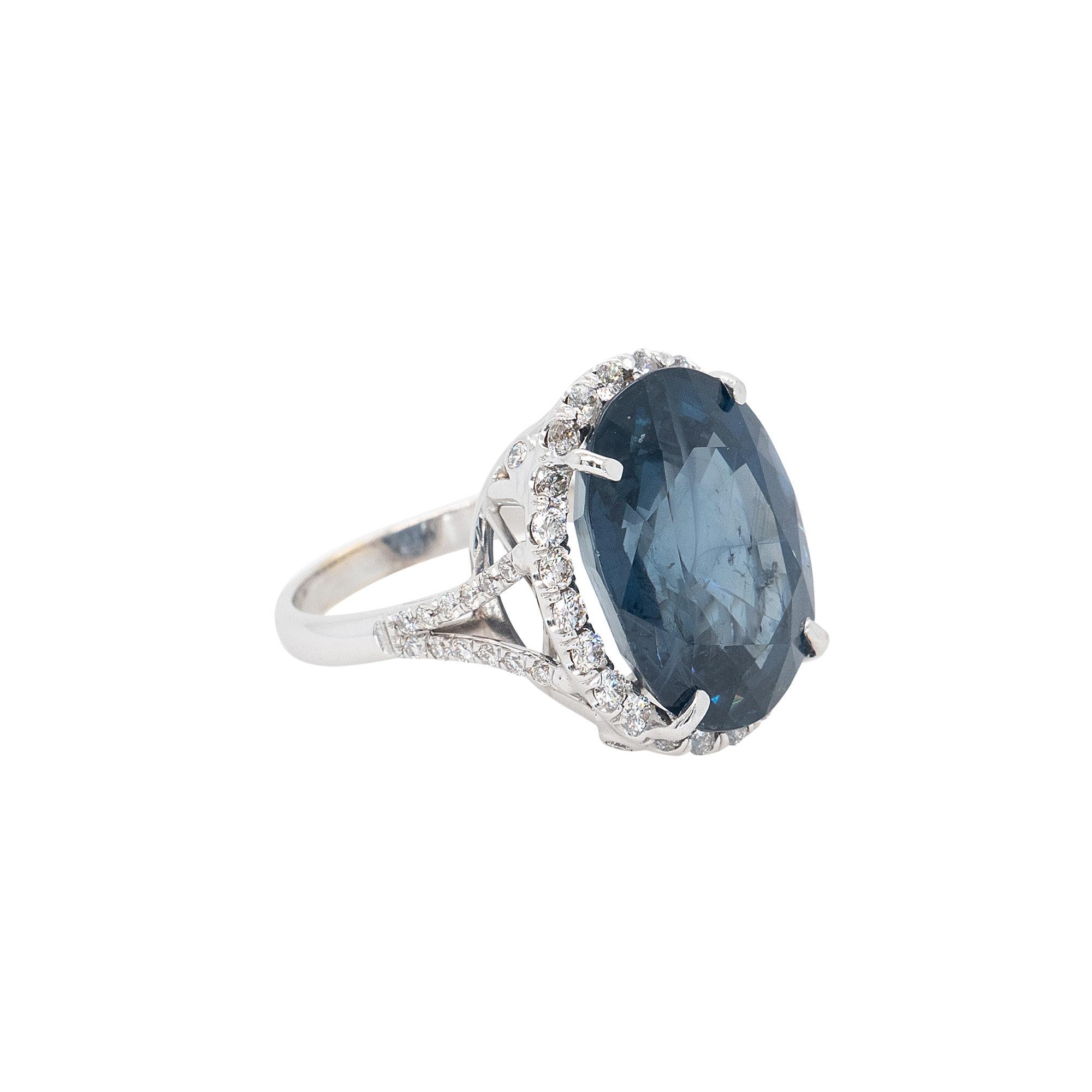 Center Details: 18.41ct Oval Sapphire
Ring Material:	
18k White Gold
Approx 1ctw Natural Round Brilliant Cut Diamonds (48 Diamonds)
20mm x 20mm x 30mm
Ring Size: 7 (can be sized)
Total Weight: 9.8g (6.3dwt)
This item comes with a presentation