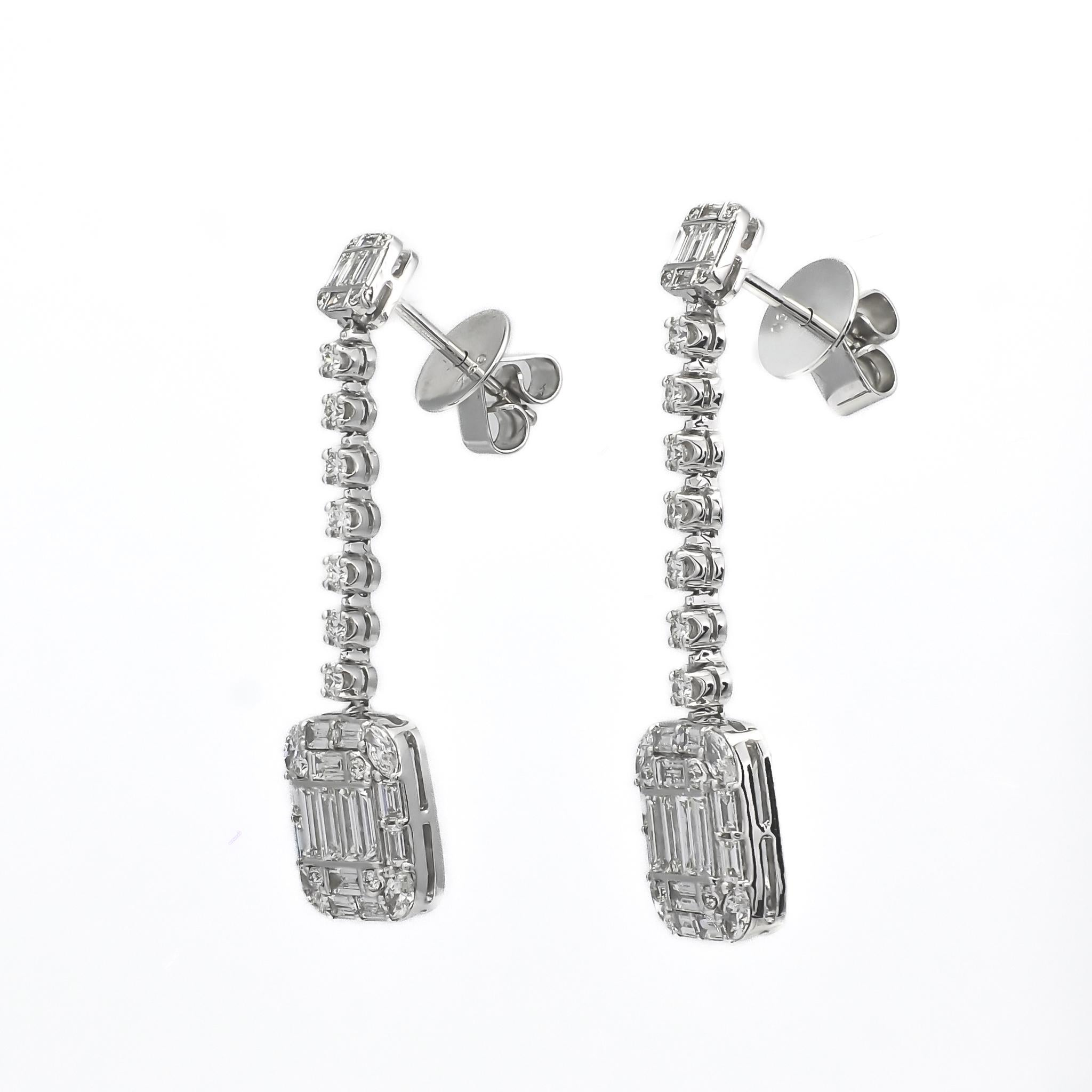 These earrings feature a cluster drop dangler design, combining elegance and sophistication.

The earrings consist of two clusters—one small cluster and one big cluster—both adorned with shimmering diamonds. The small cluster is delicately crafted