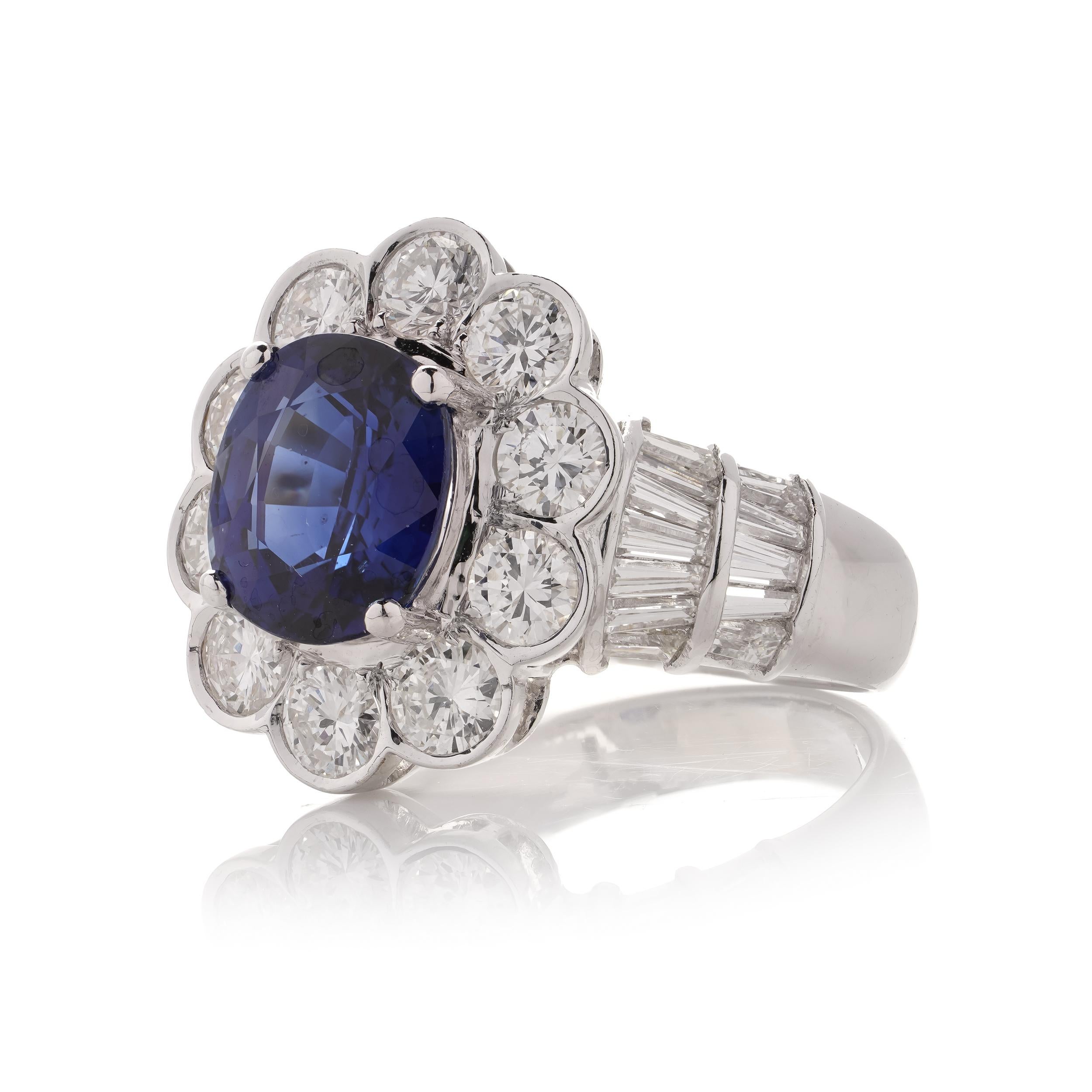 Women's 18kt White Gold 3.30 Carat Oval Blue Sapphire Cluster Ladies Ring with Diamonds For Sale