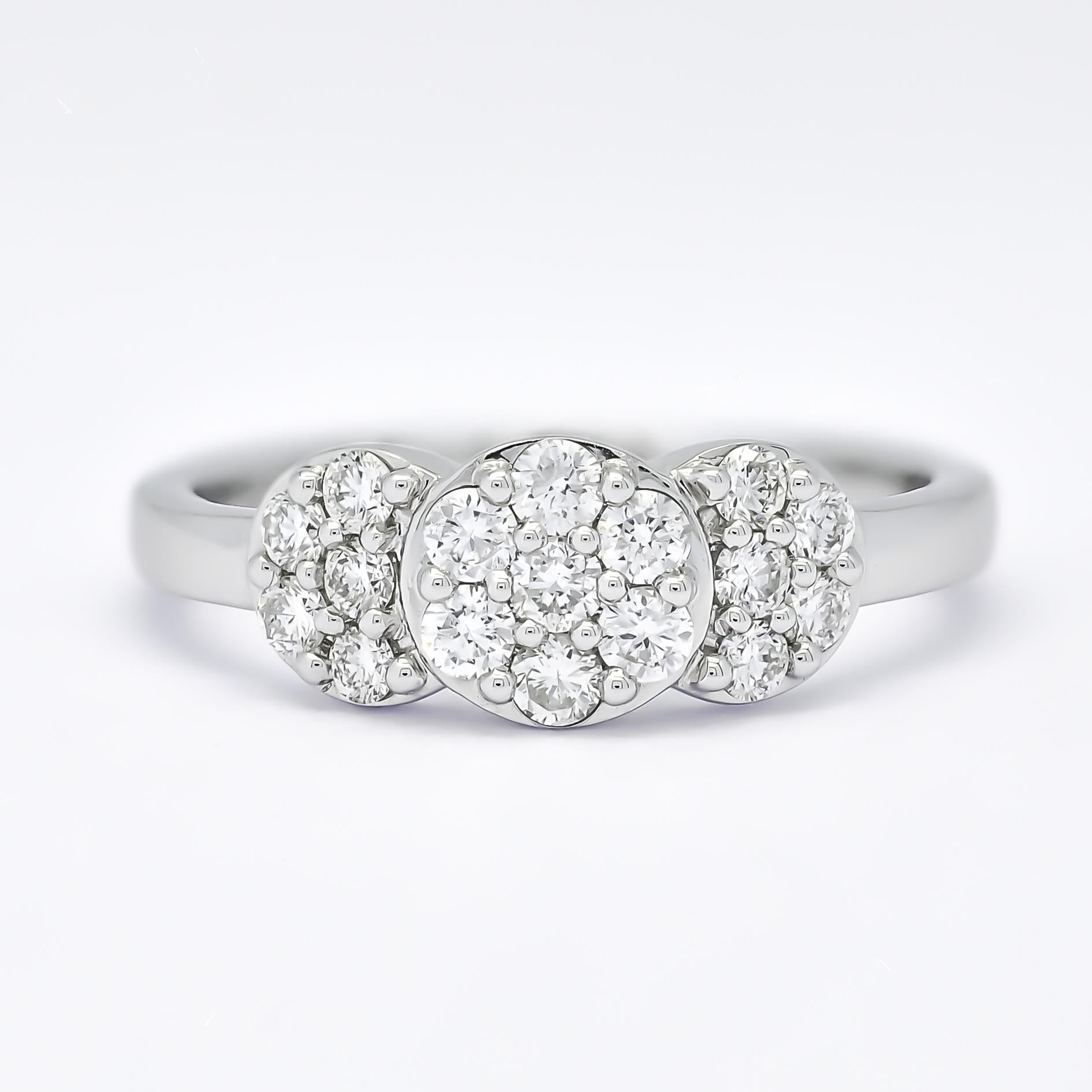 Incredibly glamorous and luxurious, this ring is filled with a cluster of round brilliant diamonds to form the round shapes and Crescent Shape in bezel setting and gives the illusion of  large diamonds. 

Metal: 18kt White Gold
Weight:3.37 Grams