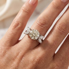 18KT White Gold 3.00ct Diamond Ring with Marquise Side Stones