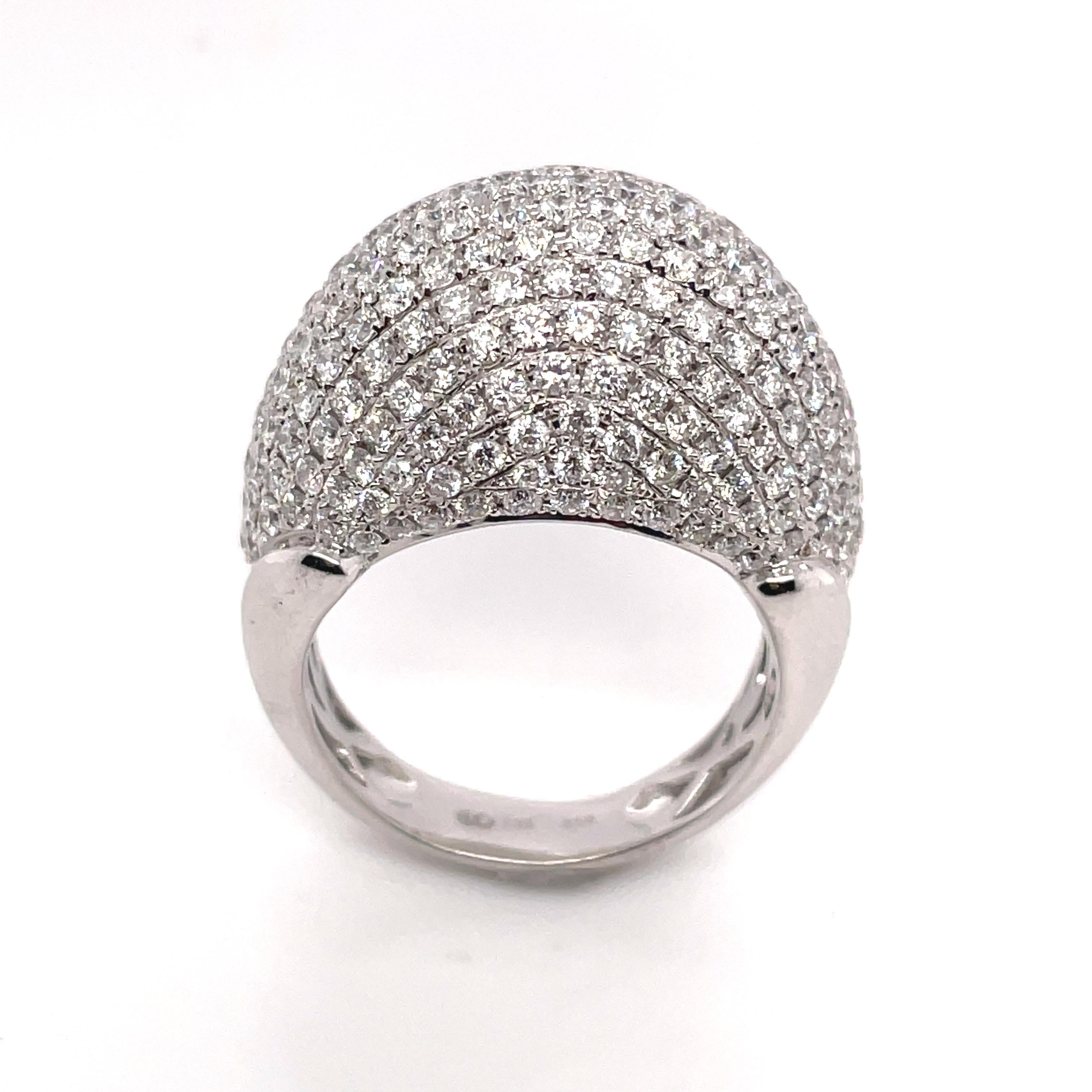 A beautiful white gold ring with round brilliant cut white diamonds. This ring is studded with 198 round brilliant cut diamonds. All the stones are pave set. The total diamond weight is 3.10ct. The white diamonds are F-G color and VS2/SI1 clarity.