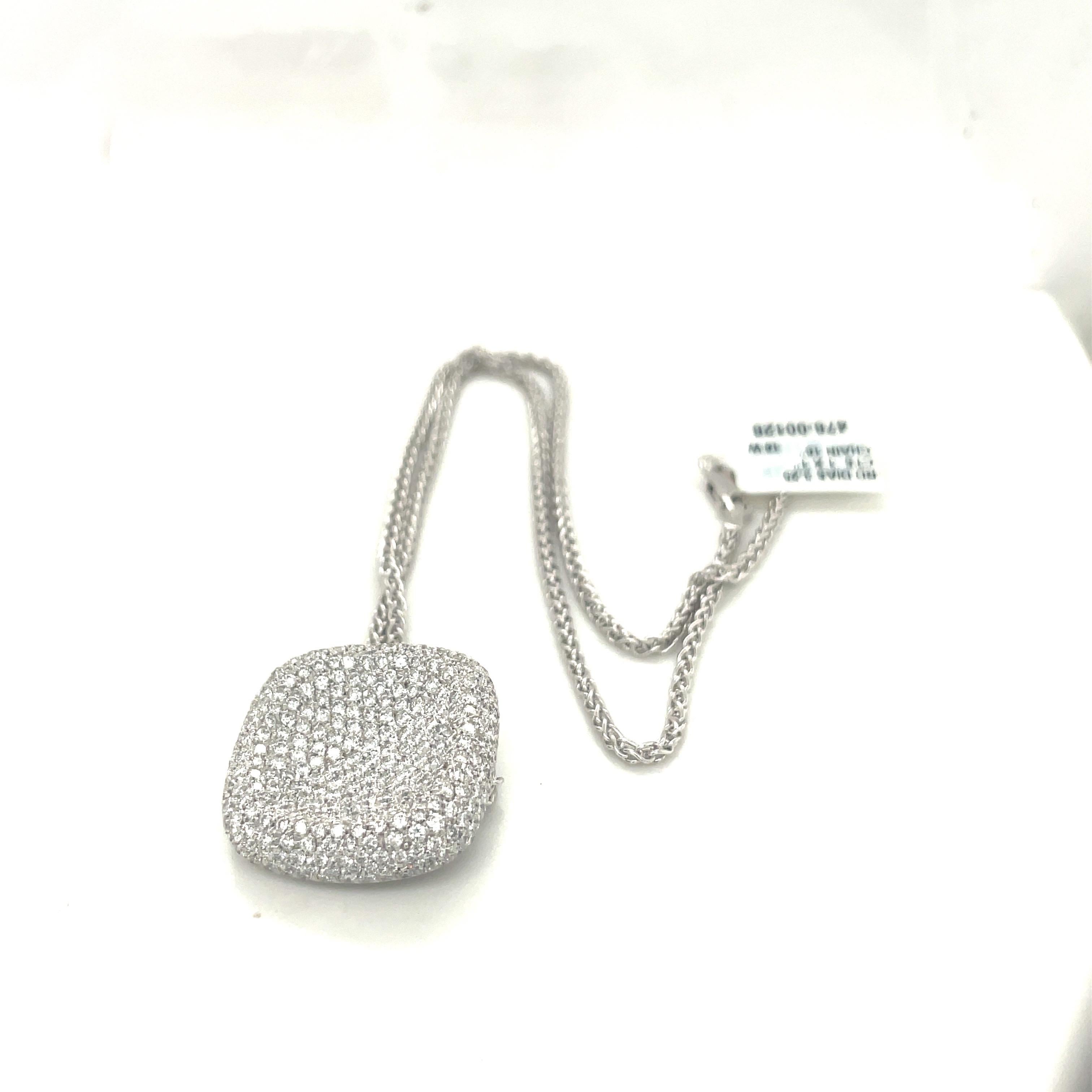 This 18 karat white gold and diamond pendant is designed in a cushion shape, which has been beautifully pave set with 3.25 carats of diamonds. The cushion shaped pendant is convex, giving it an added dimension. The 1'