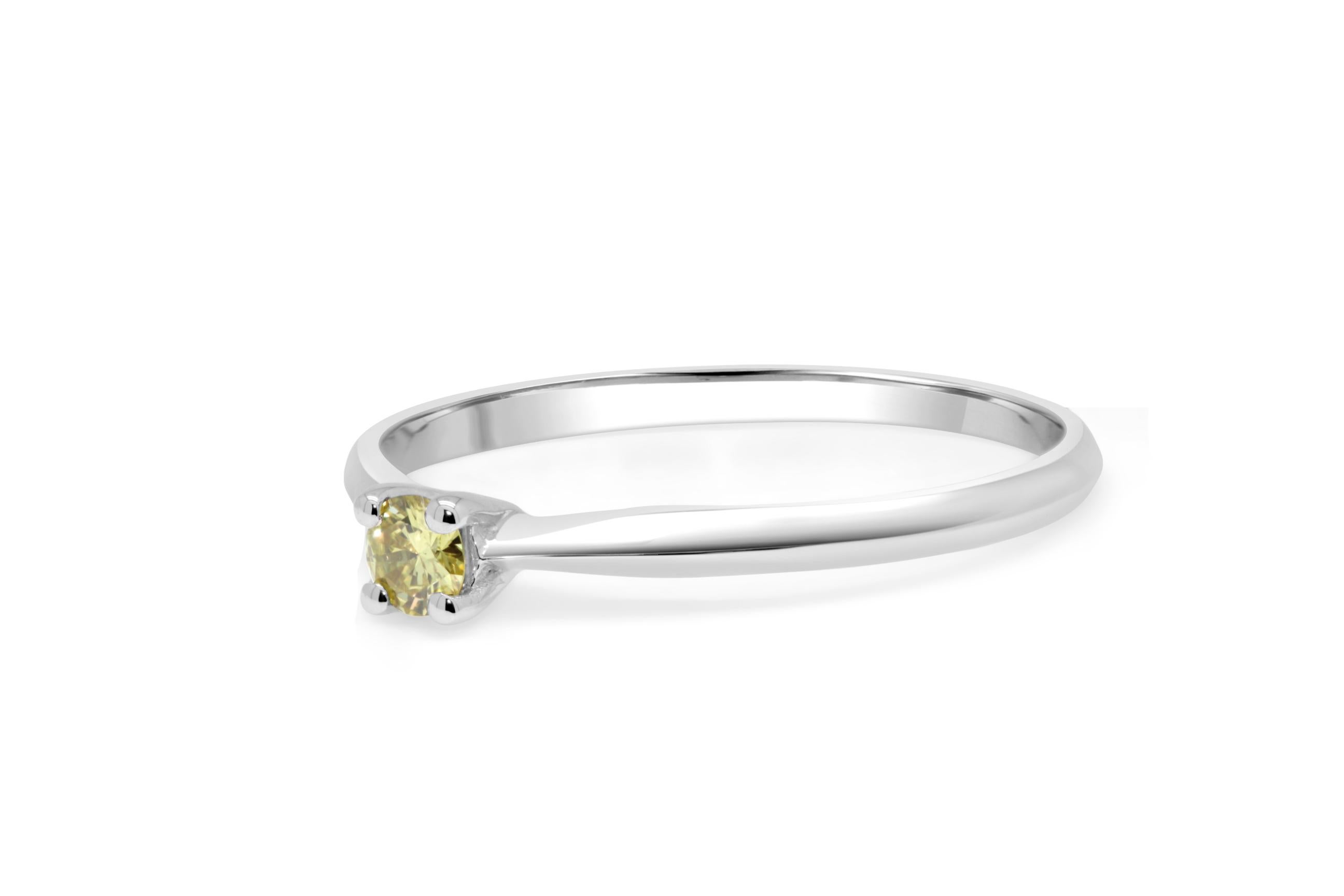 adorable, casual and classy 4 prongs design engagement ring.
a beautiful brilliant cut diamond of 0.09ct set in an 18kt white gold ring.
diamond has a beautiful fancy yellow color and is of VS purity.
can be used as a stack ring as well.
the ring