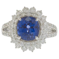 Bague en or blanc 18KT 4.89CT saphir et 2.14CT diamant Cluster