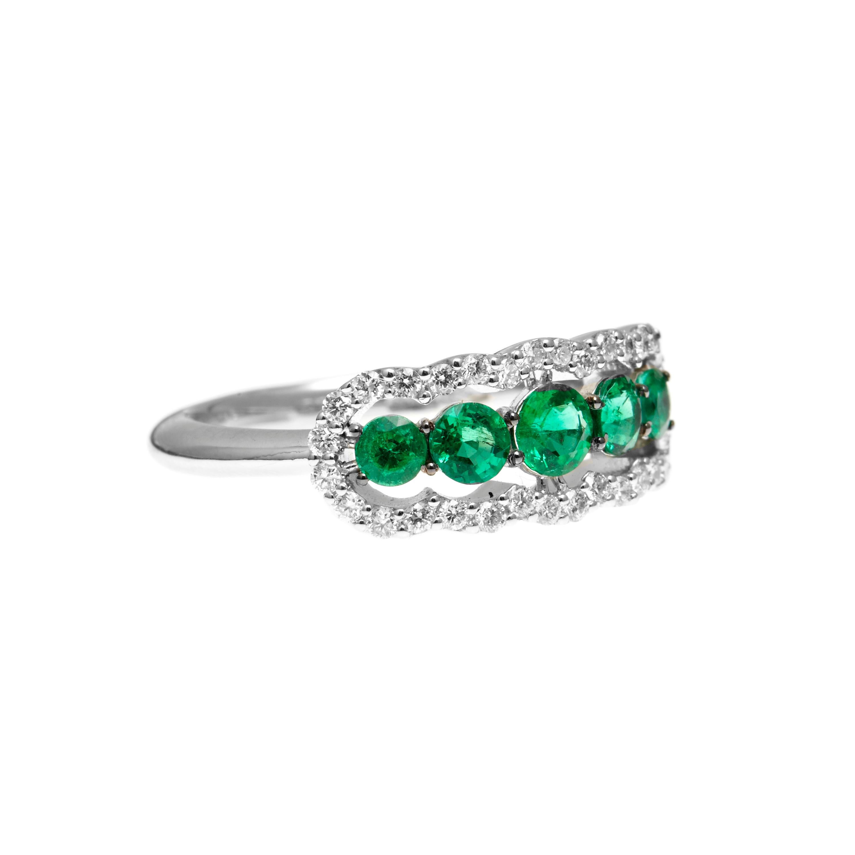 The fabulous everyday ring is perfect when you want to match some bold green tones with your outfit. 5 graduated round emeralds form a bold green row and total 0.74ct and are surrounded by 0.30ct of white diamonds to give it a nice pop.