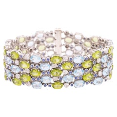 18kt White Gold 5 Strand Bracelet W/ Diamonds, Peridots, Sapphires, & Topaz