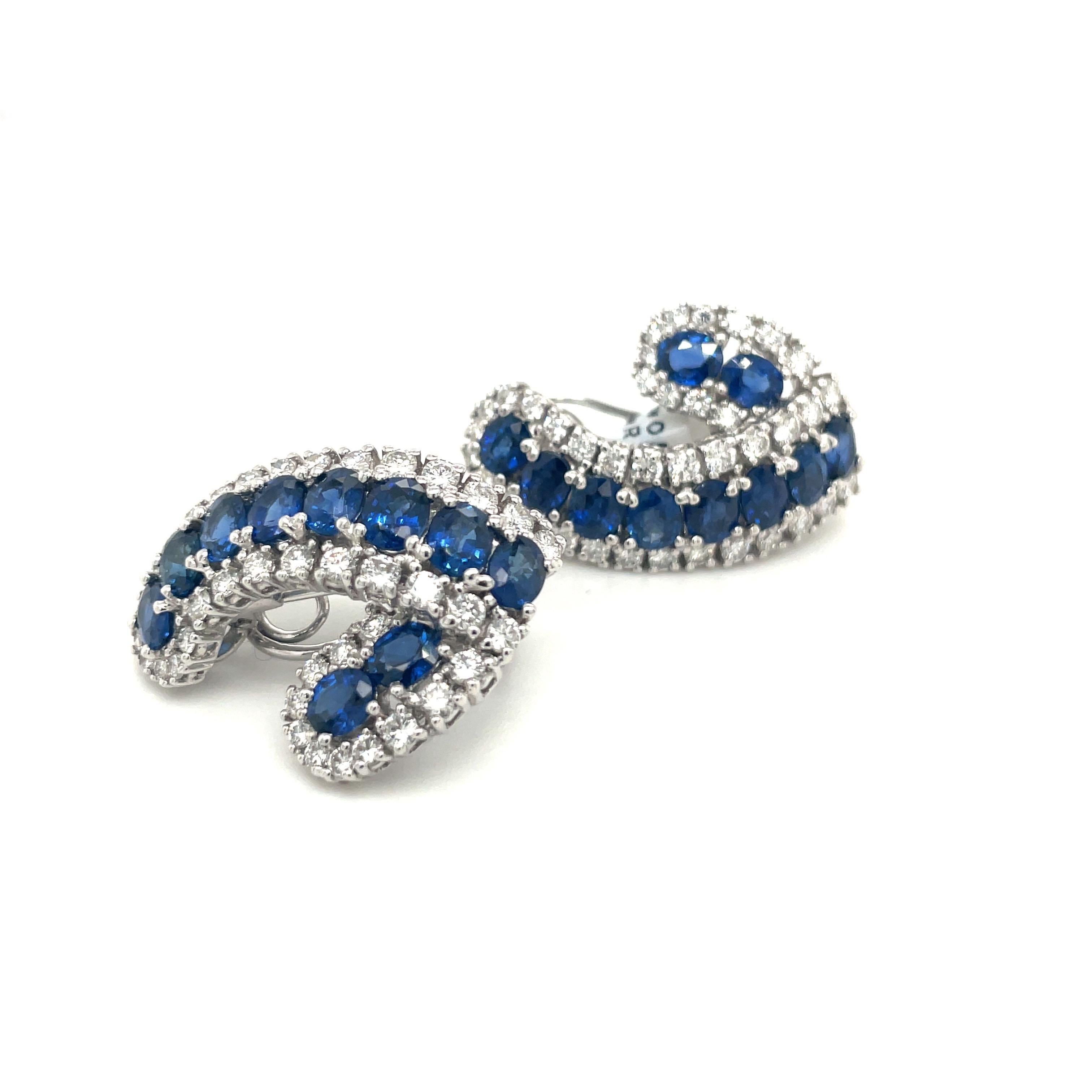 Elegant 18 karat white gold, blue sapphire and diamond earrings. The 