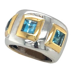 Bague jonc en or blanc 18 carats et topaze bleue
