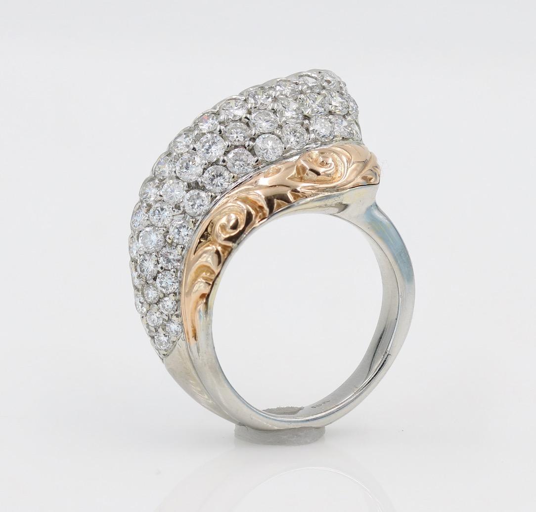 18kt White Gold and Rose Gold Diamond Ring - 44 round cut diamond (G-H VS-SI1) weighing approximately 1.25cts total. Diamonds are pave set with a fine honeycomb piercing on the back. Ring features a hand carved Rose Gold design. Ring is a size 5