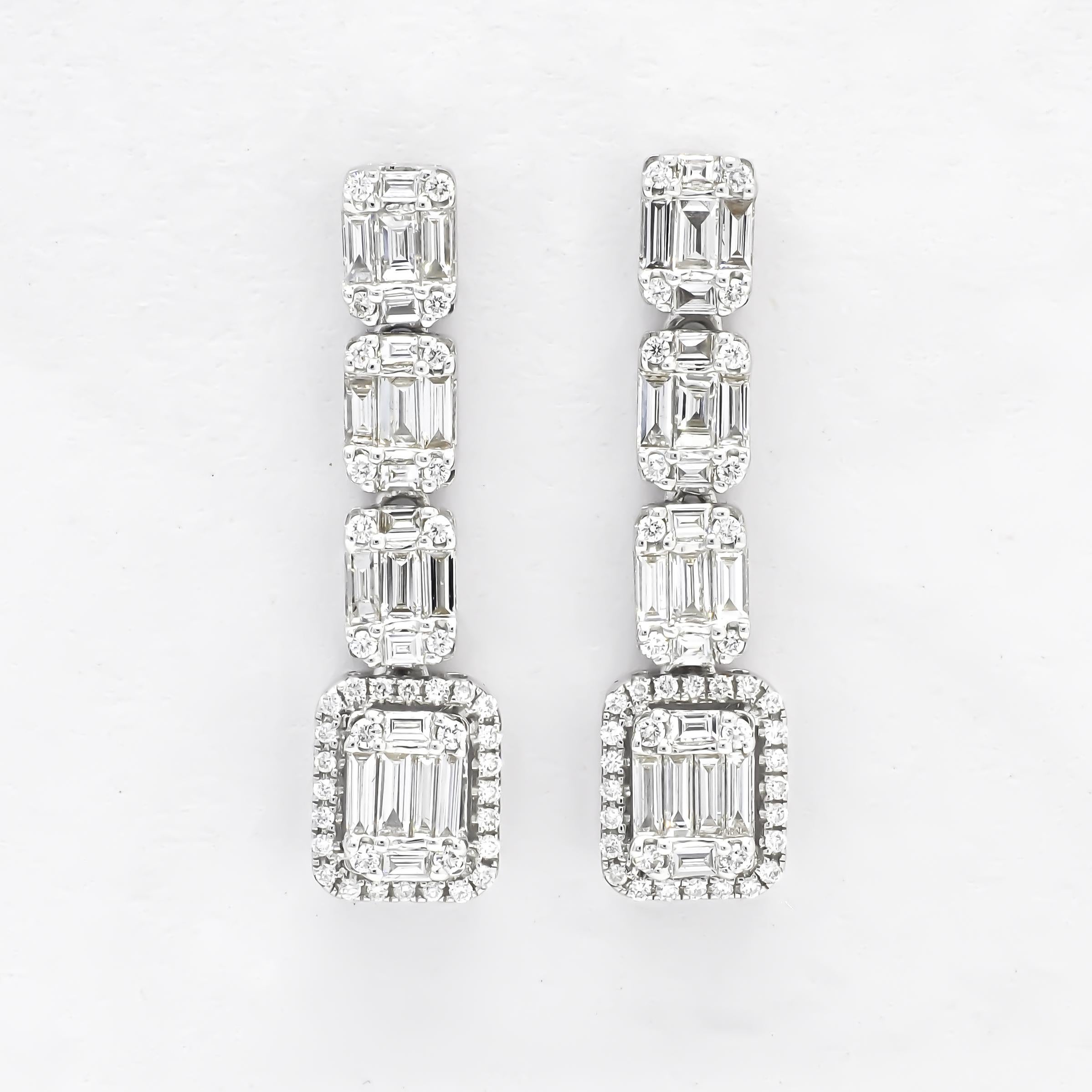 Keep them dazzled, with these ultra elegant diamond cluster baguette and round cluster earrings. Refine your look with the elegant glow of these dangling diamond cluster dangle drop earrings.

The earrings feature a stunning combination of baguette