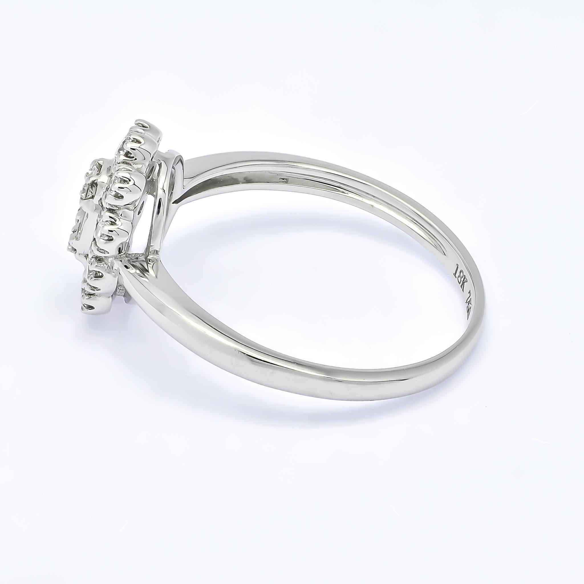 This muted vintage engagement ring features a oval shape cluster of baguettes set in the center with prong set round diamonds along the outer halo in a glamorous Victorian style engagement ring. 

A vintage cluster diamond ring is a beautiful and