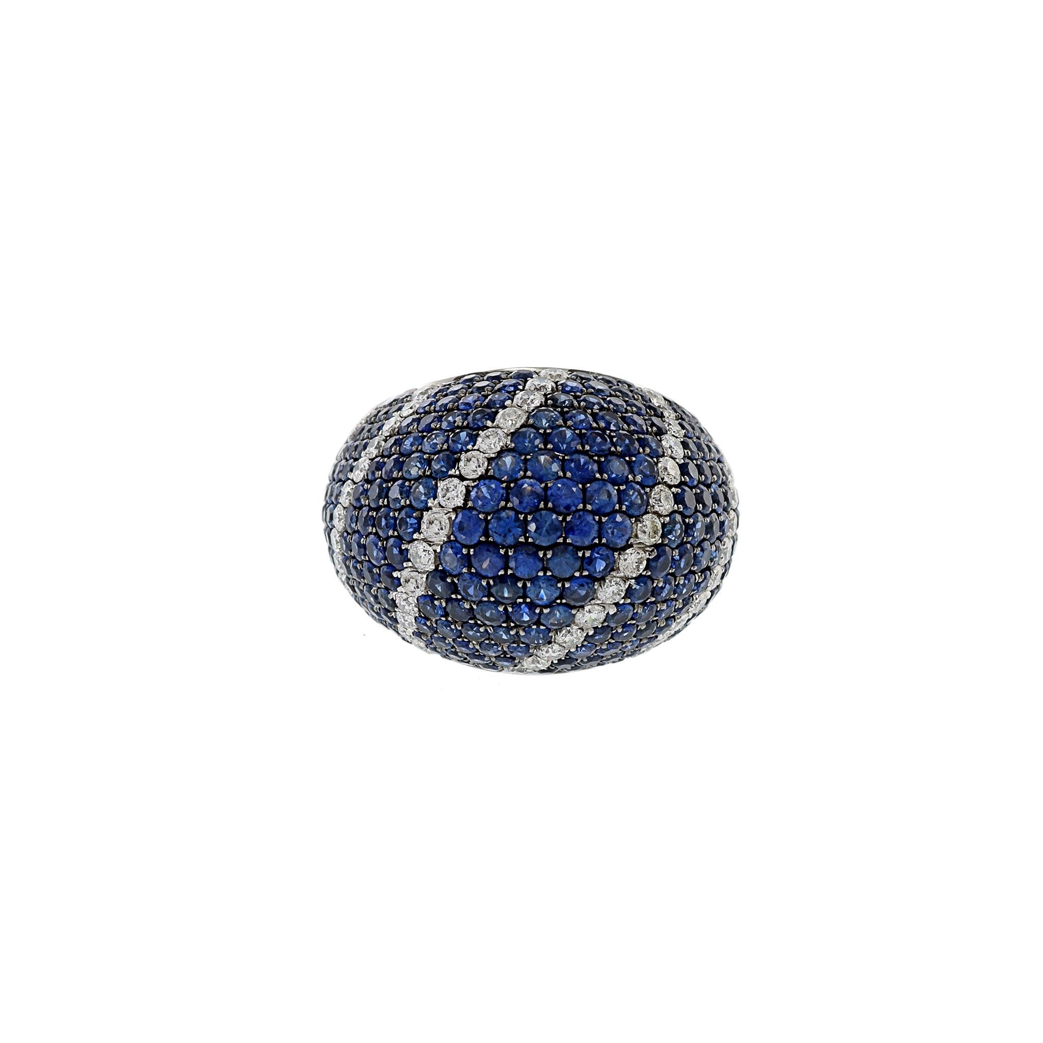 Introducing a truly opulent piece of jewelry - an 18KT white gold dome ring adorned with 6.42CT-tw of captivating blue sapphires and 1.21CT-TW of brilliant round-cut diamonds. Certified by GAL for authenticity, this ring is a symbol of timeless