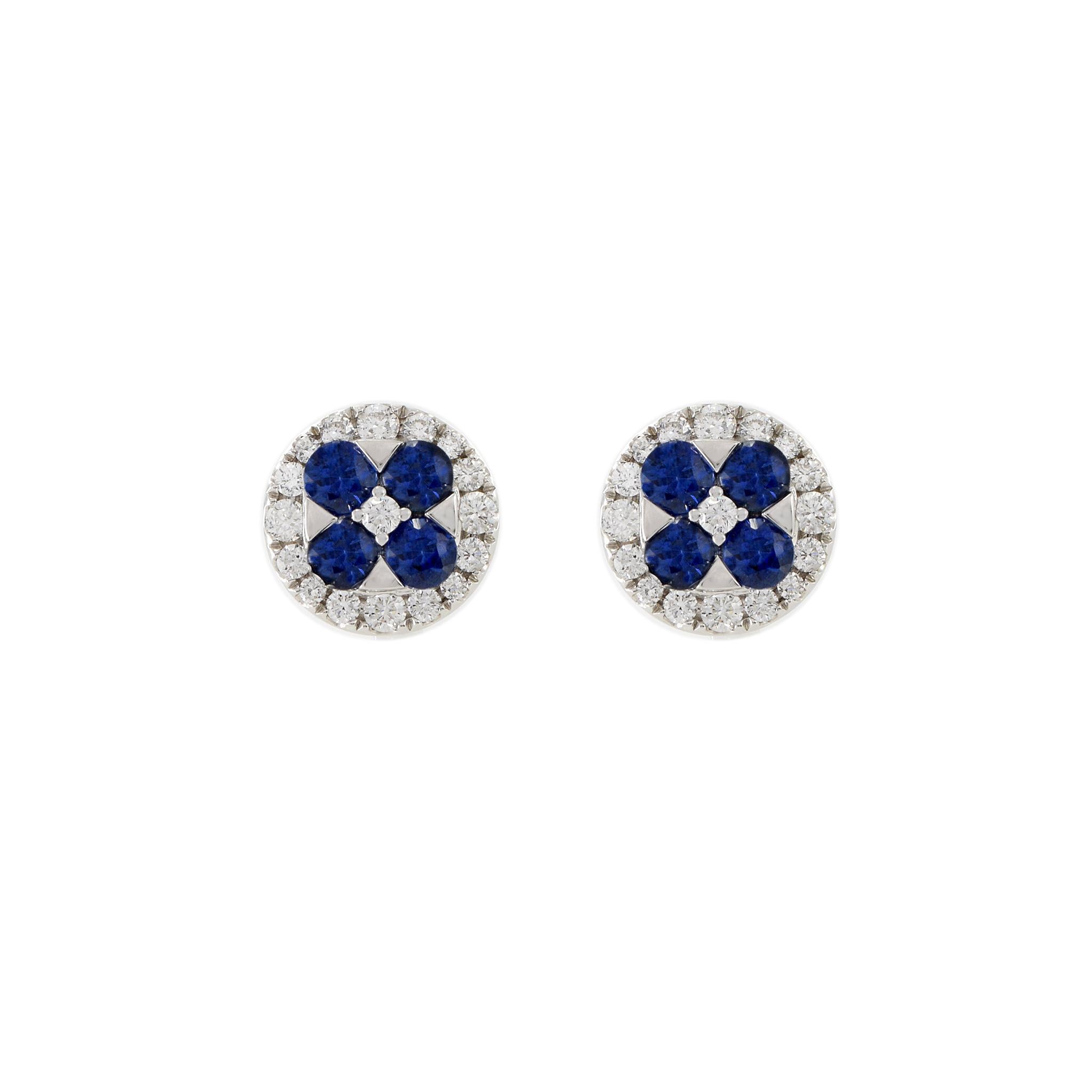These exquisite earrings is crafted with 18KT white gold and adorned with 1.44CT of round cut Blue Sapphires and 0.65CT-TW G color, VS1-VS2 Clarity of round cut diamonds, making it a stunning addition to any jewelry collection.