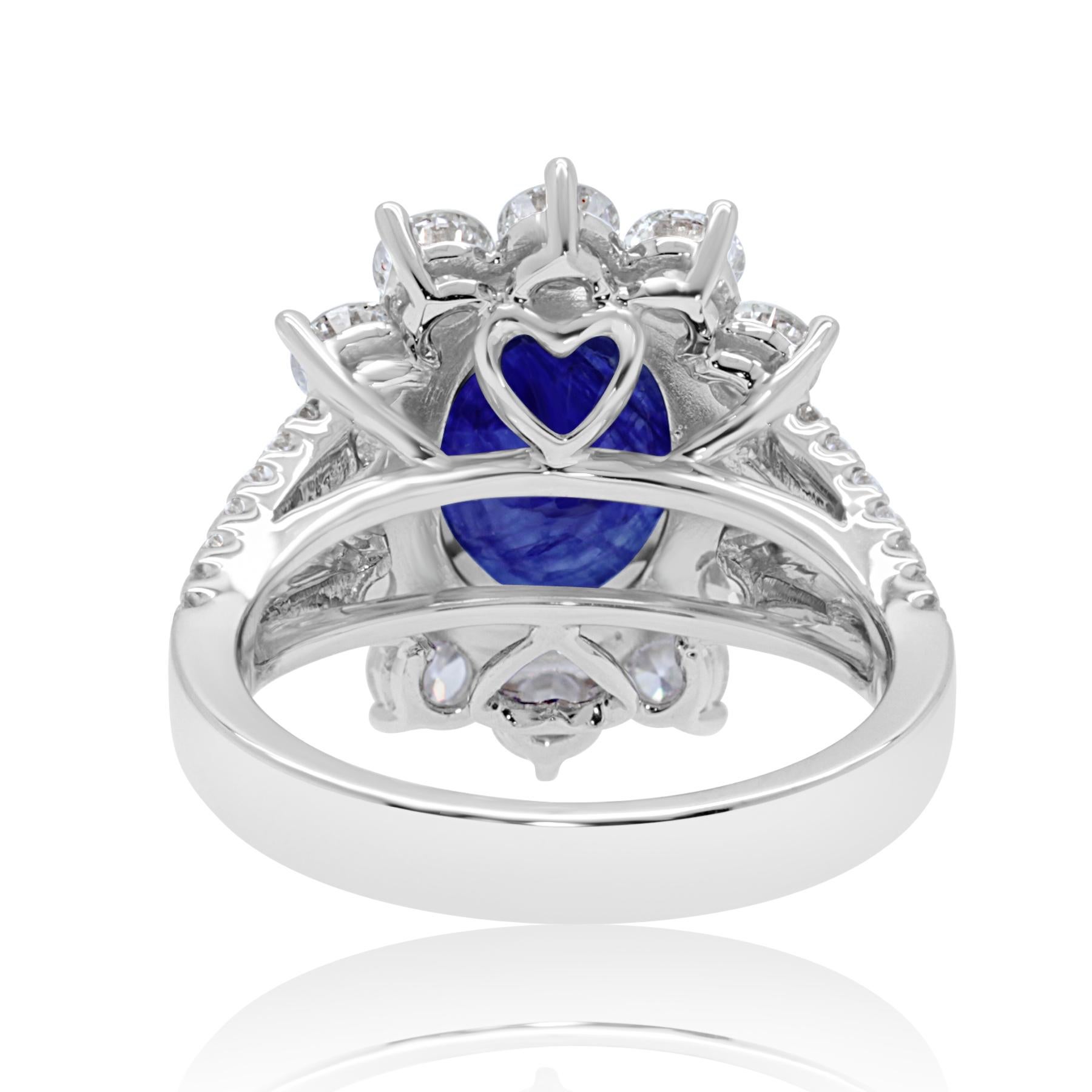Oval Cut 18 Karat White Gold Blue Sapphire Ring Set with Brilliant Cut Diamonds For Sale